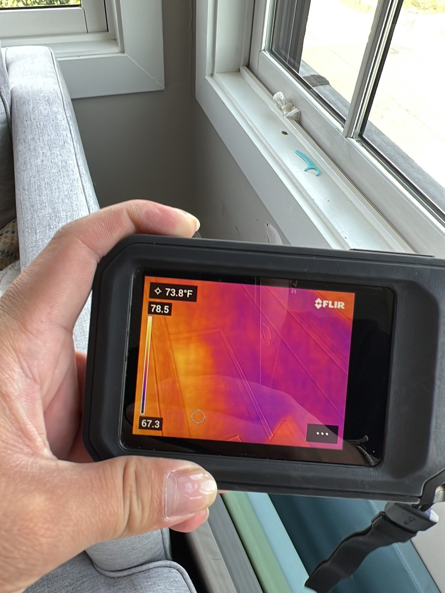Ceiling damage assessment during water restoration, drywall and insulation exposure documented.