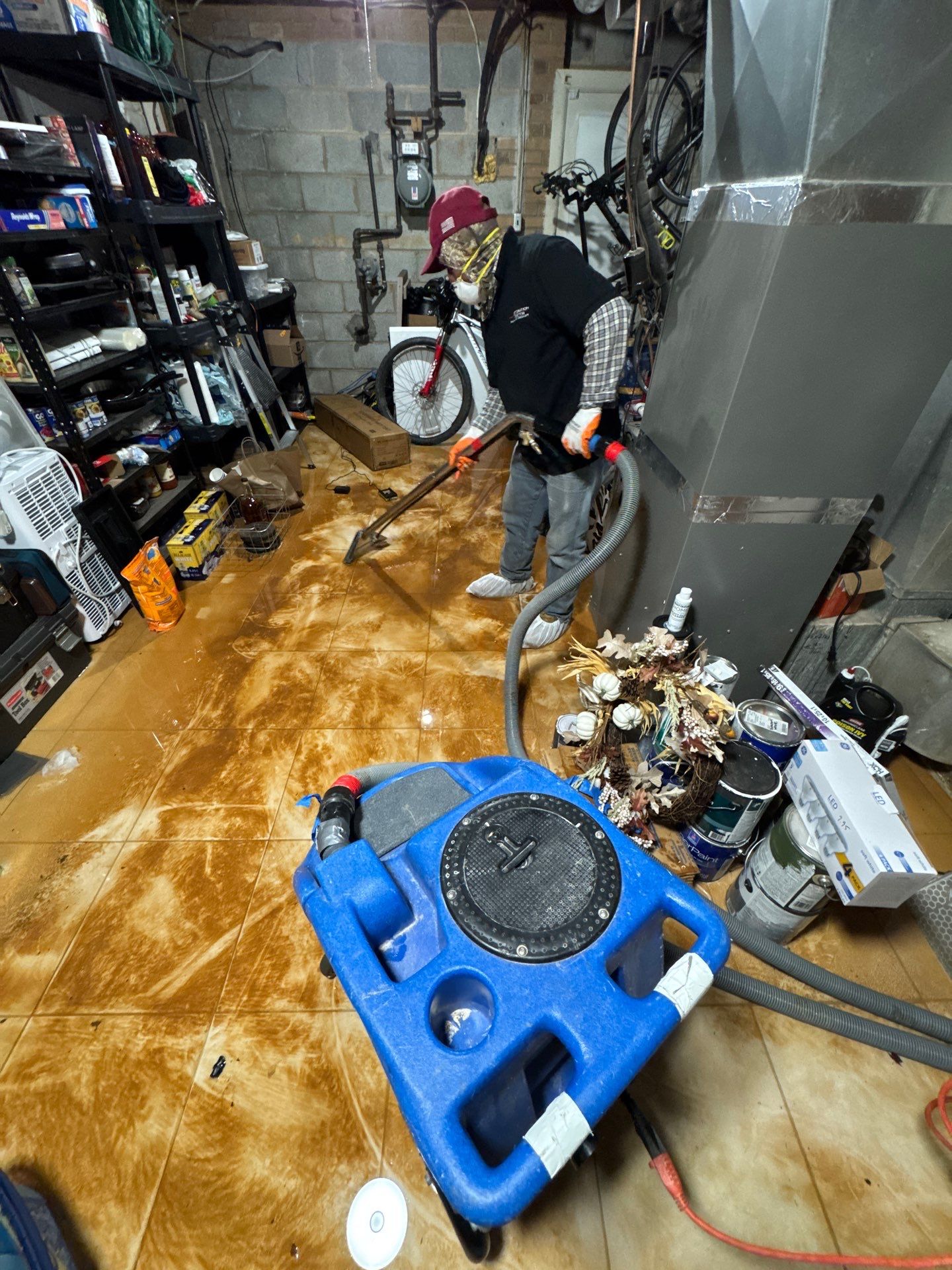 Mold remediation in Rockville: containment setup with dehumidifiers and air movers positioned for structural drying.