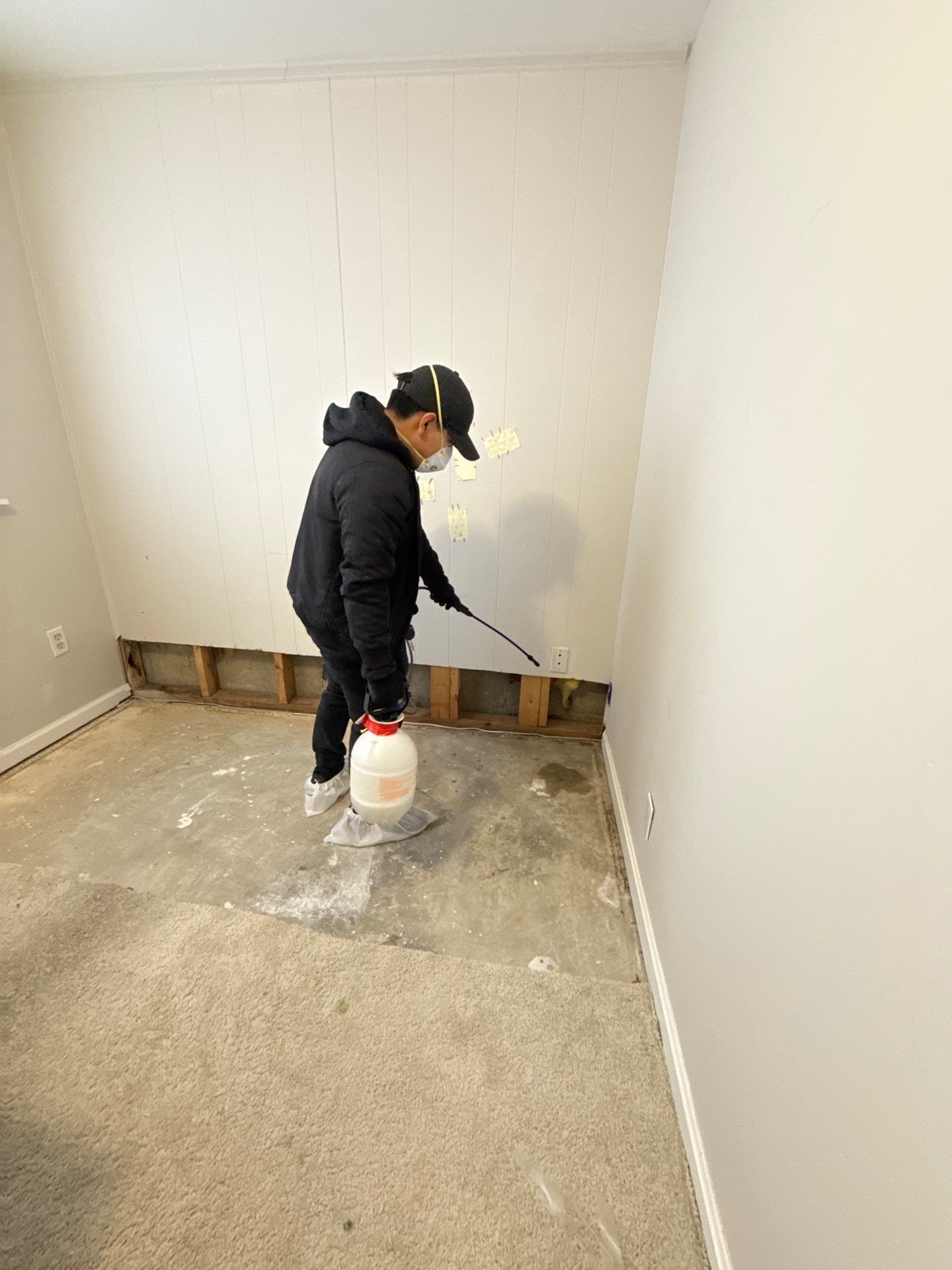 Structural drying equipment positioned to address moisture penetration in wall cavities and framing.