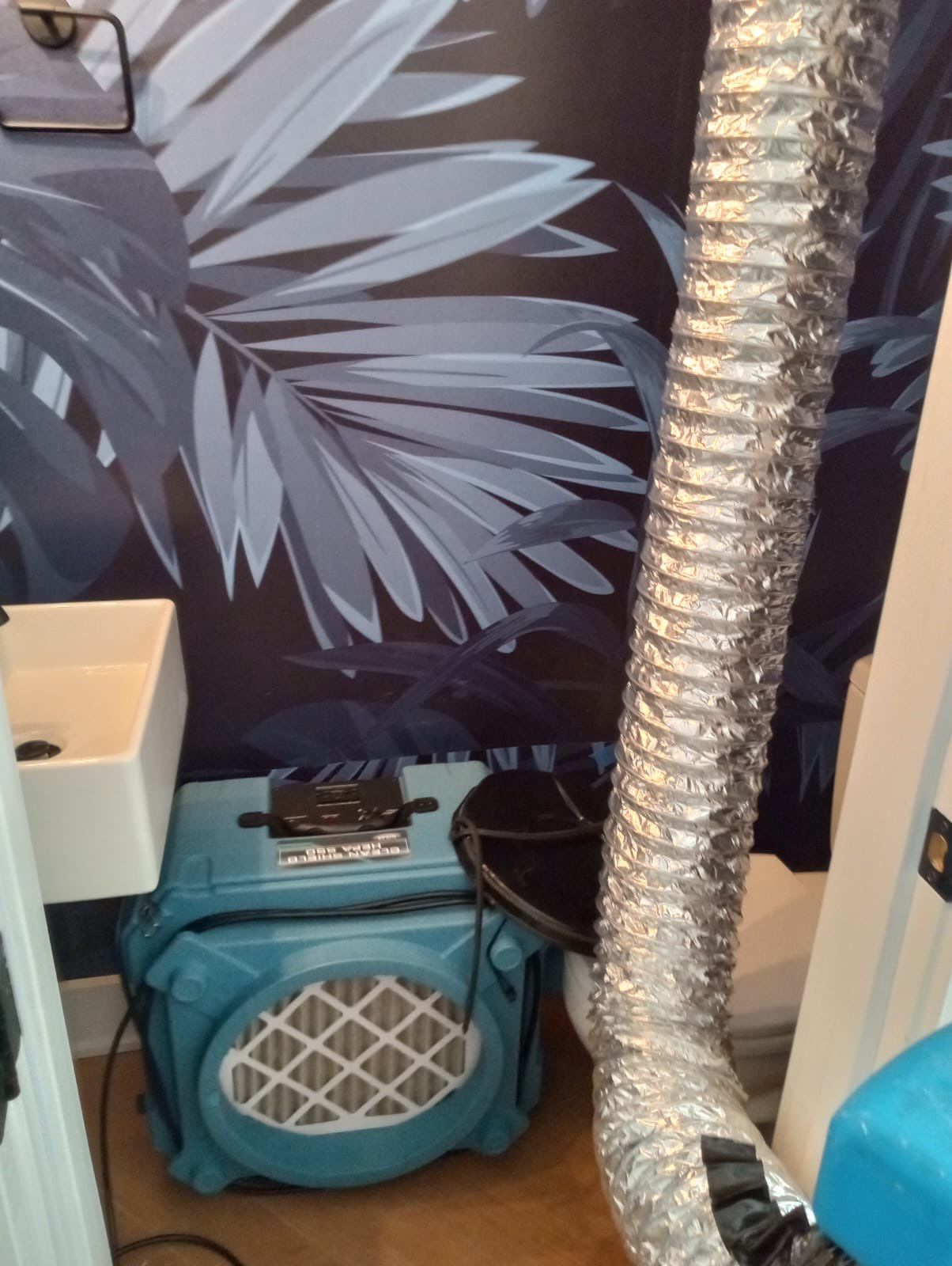 Drying equipment monitoring and moisture control during mid-stage restoration.