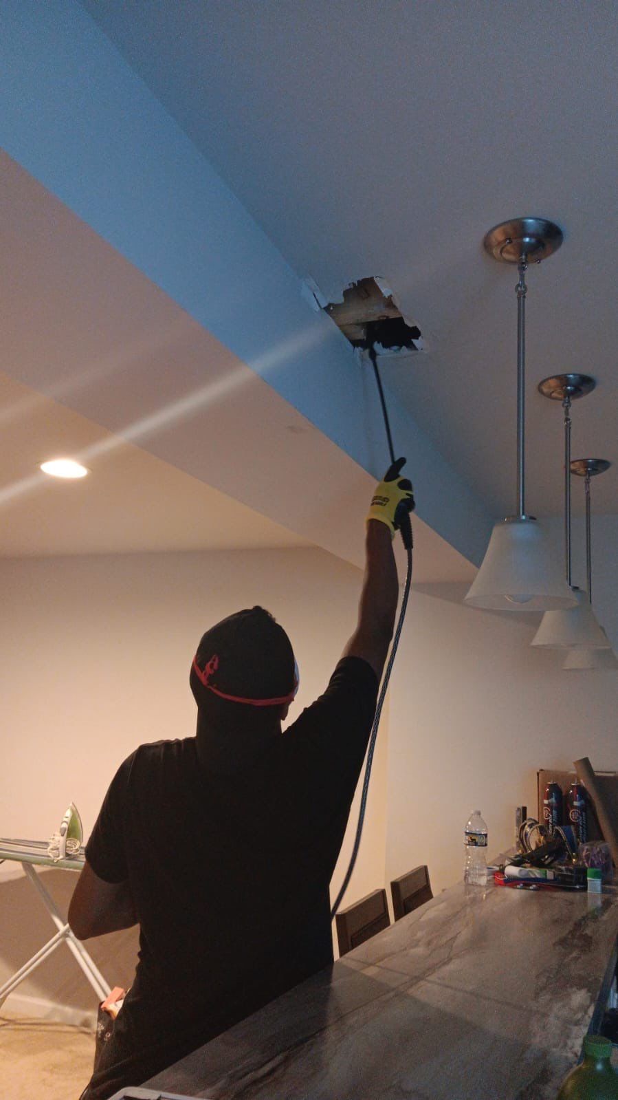 Wet drywall and ceiling materials staged for removal during water extraction and remediation work.