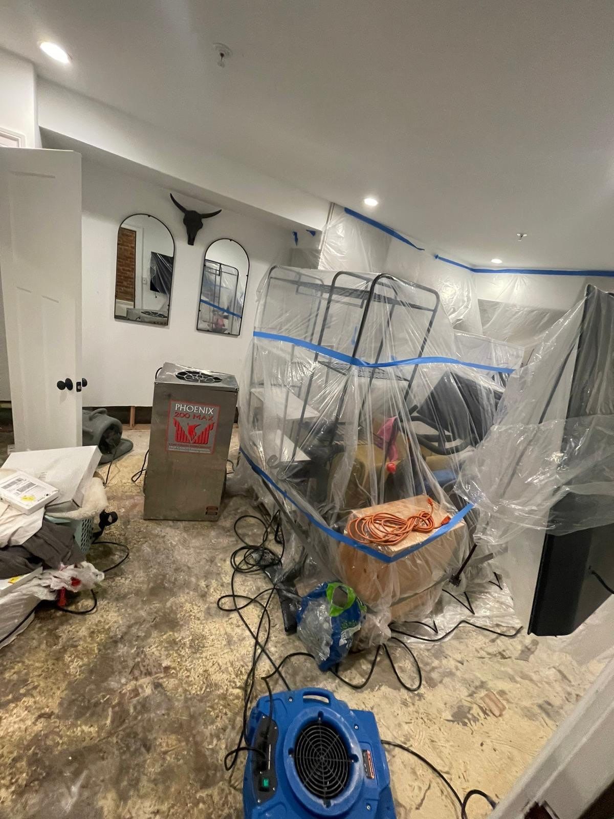 Final inspection of dried structure following water damage restoration completion.