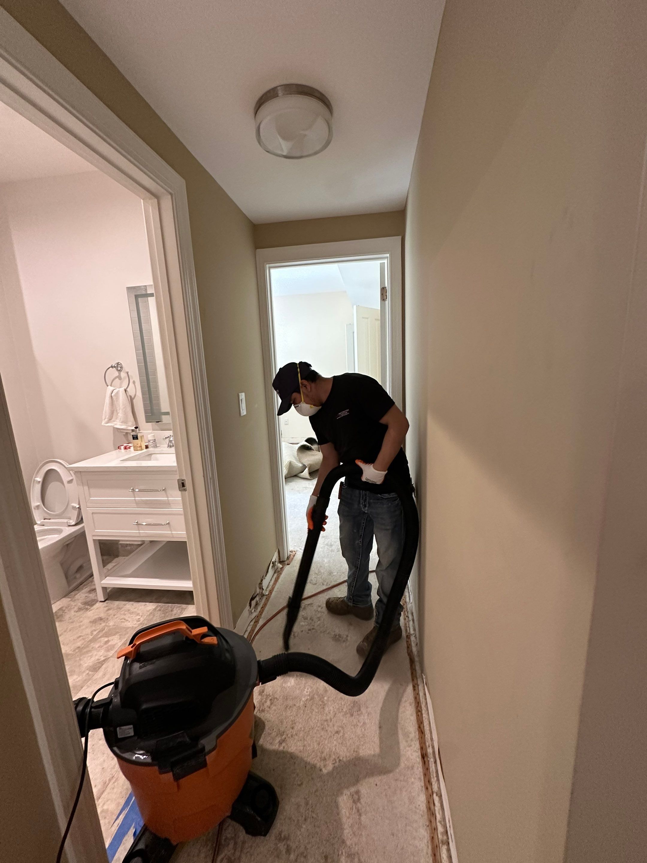 Flooring assessment underway to determine salvage versus replacement after water damage and drying.