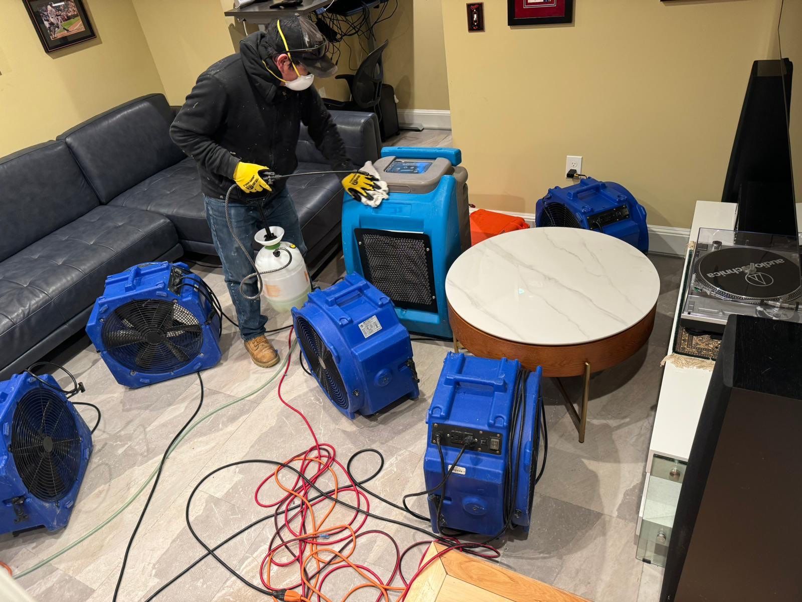 Mid-stage drying setup with extraction equipment and dehumidification units managing moisture removal.