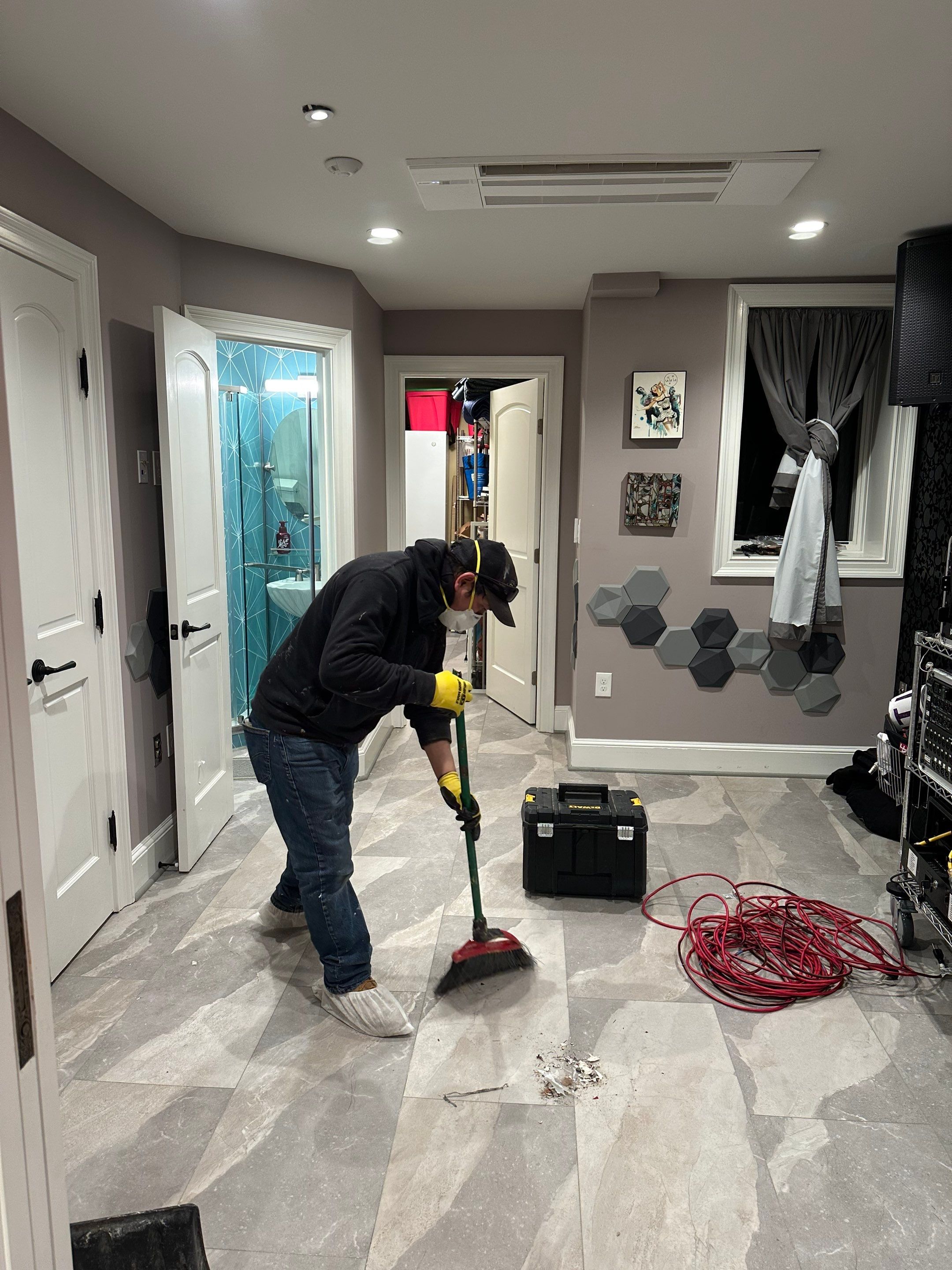 Structural drying in progress with dehumidification equipment monitoring moisture levels throughout the space.