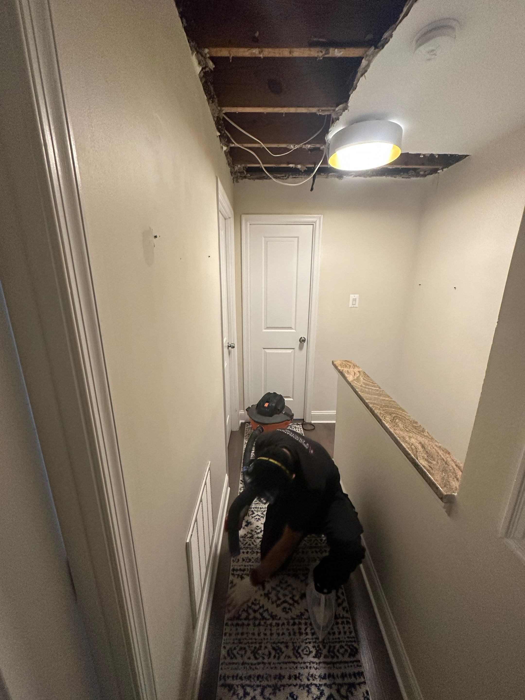 Ceiling repair completion and final structural restoration in Washington water damage job.