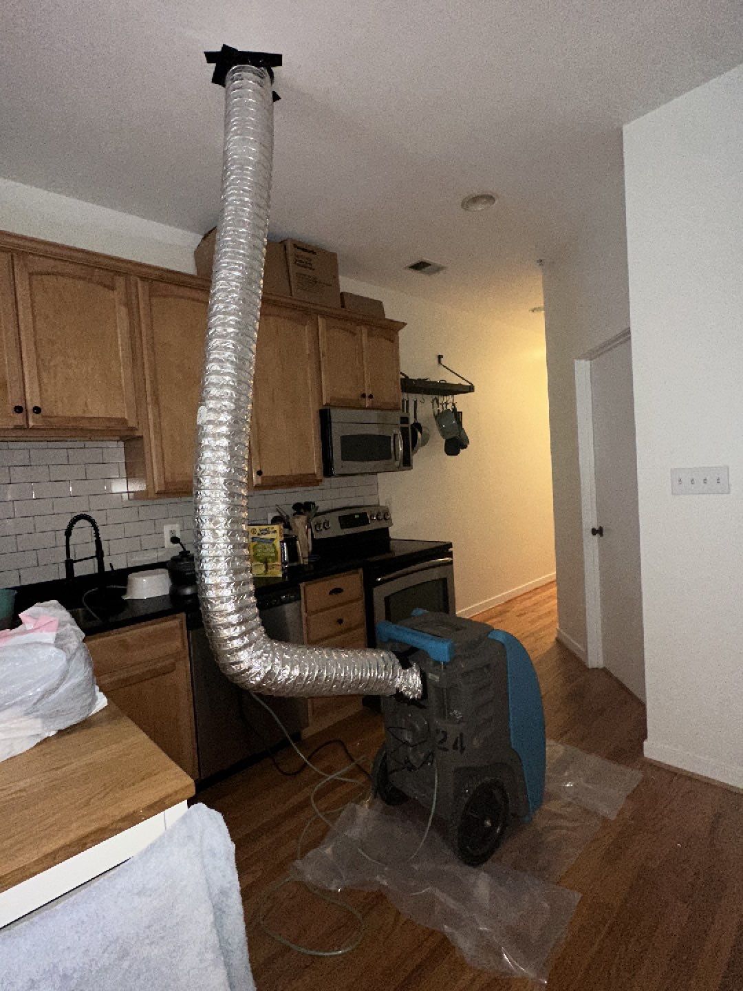 Wall replacement completion, final stage of water damage restoration in Washington.