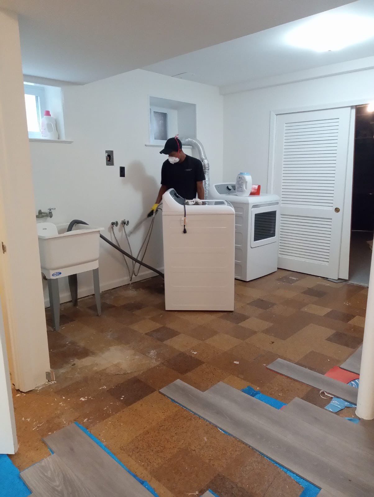 Dehumidifiers and air movers running to dry structural materials after water extraction.