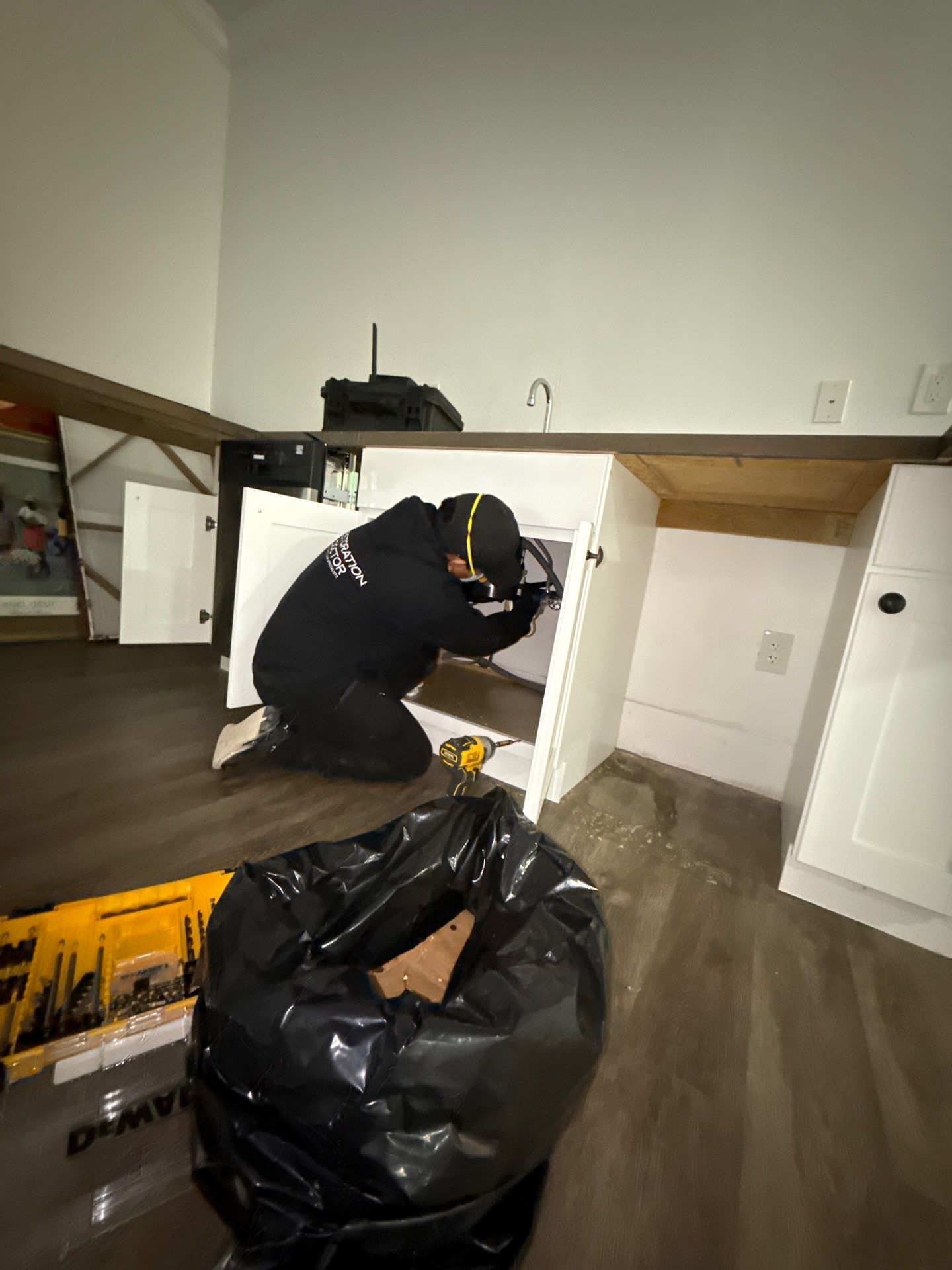 Compromised wall section prepared for removal during mold remediation structural work.