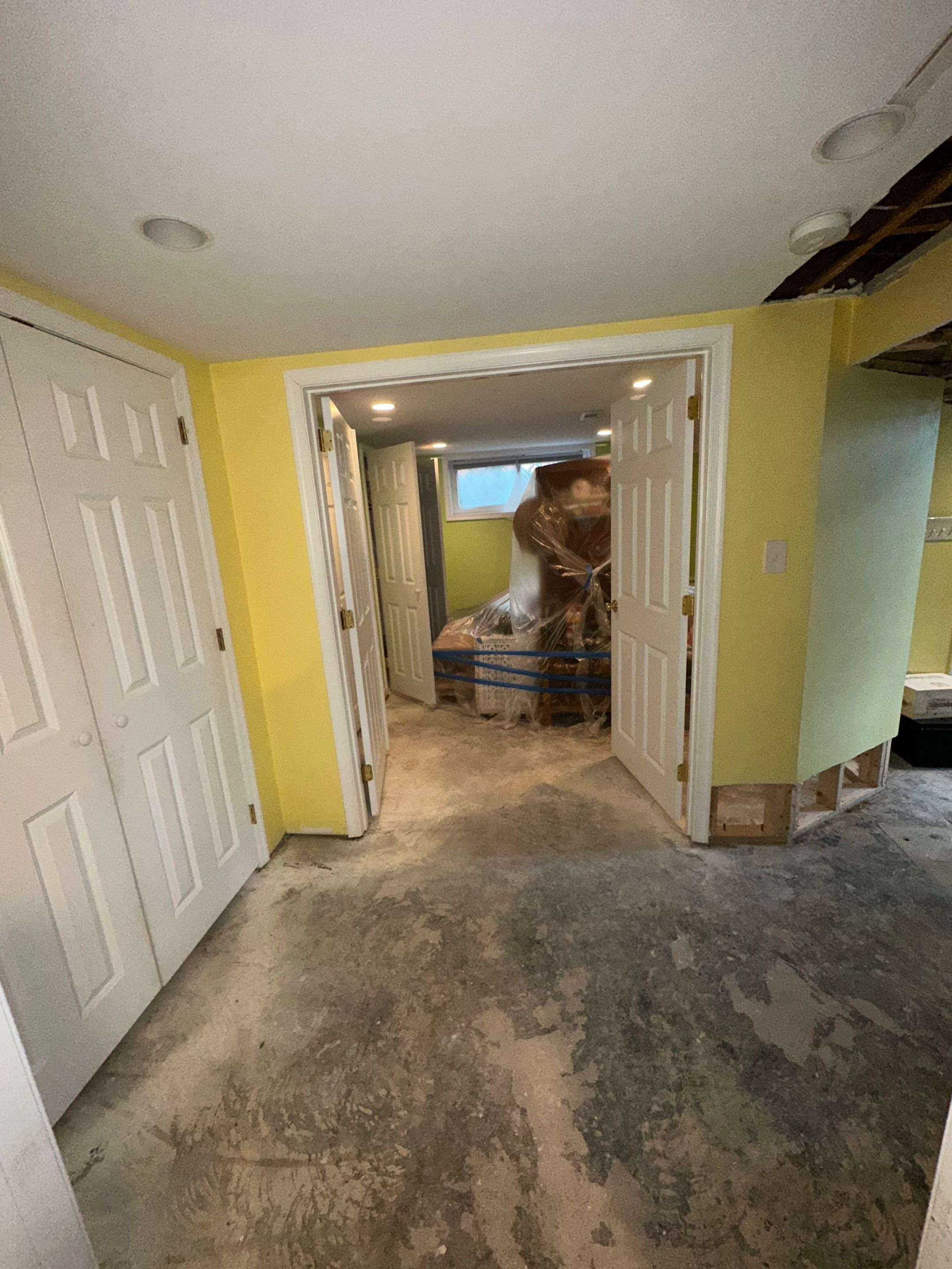 Ceiling damage assessment and preparation for repair after water extraction.