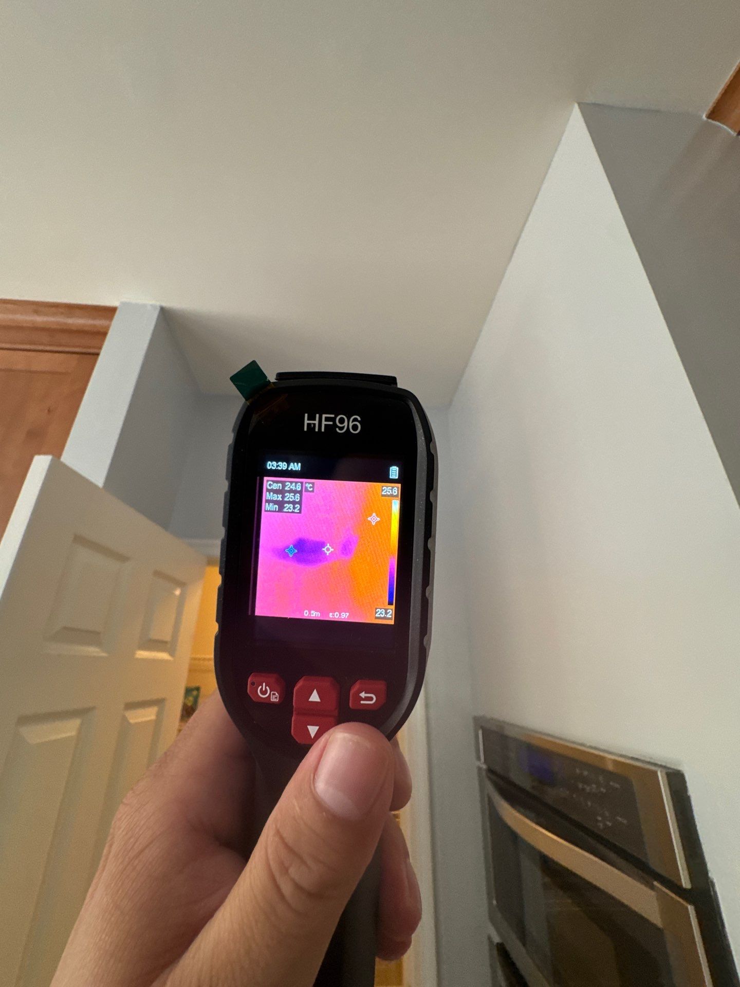 Thermal imaging reveals moisture patterns in ceiling during water damage inspection in Washington.