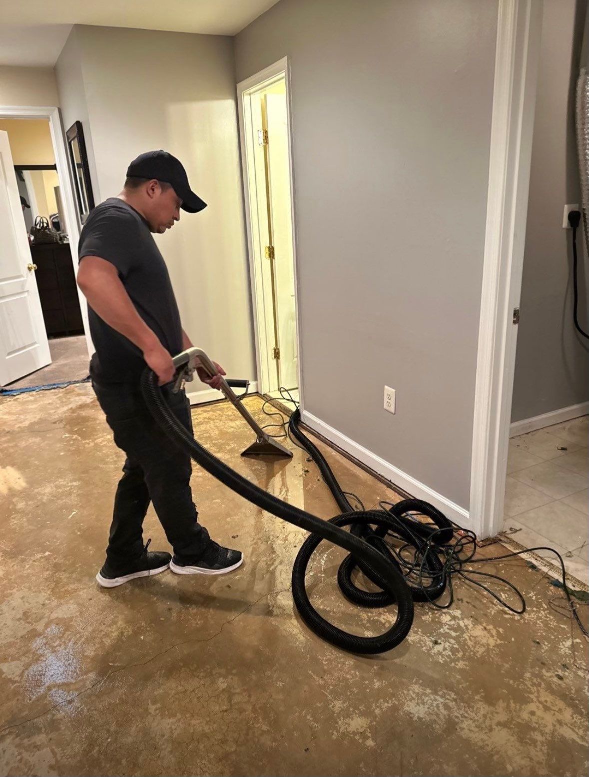 Standing water pooled across flooring during initial water damage assessment in Silver Spring.
