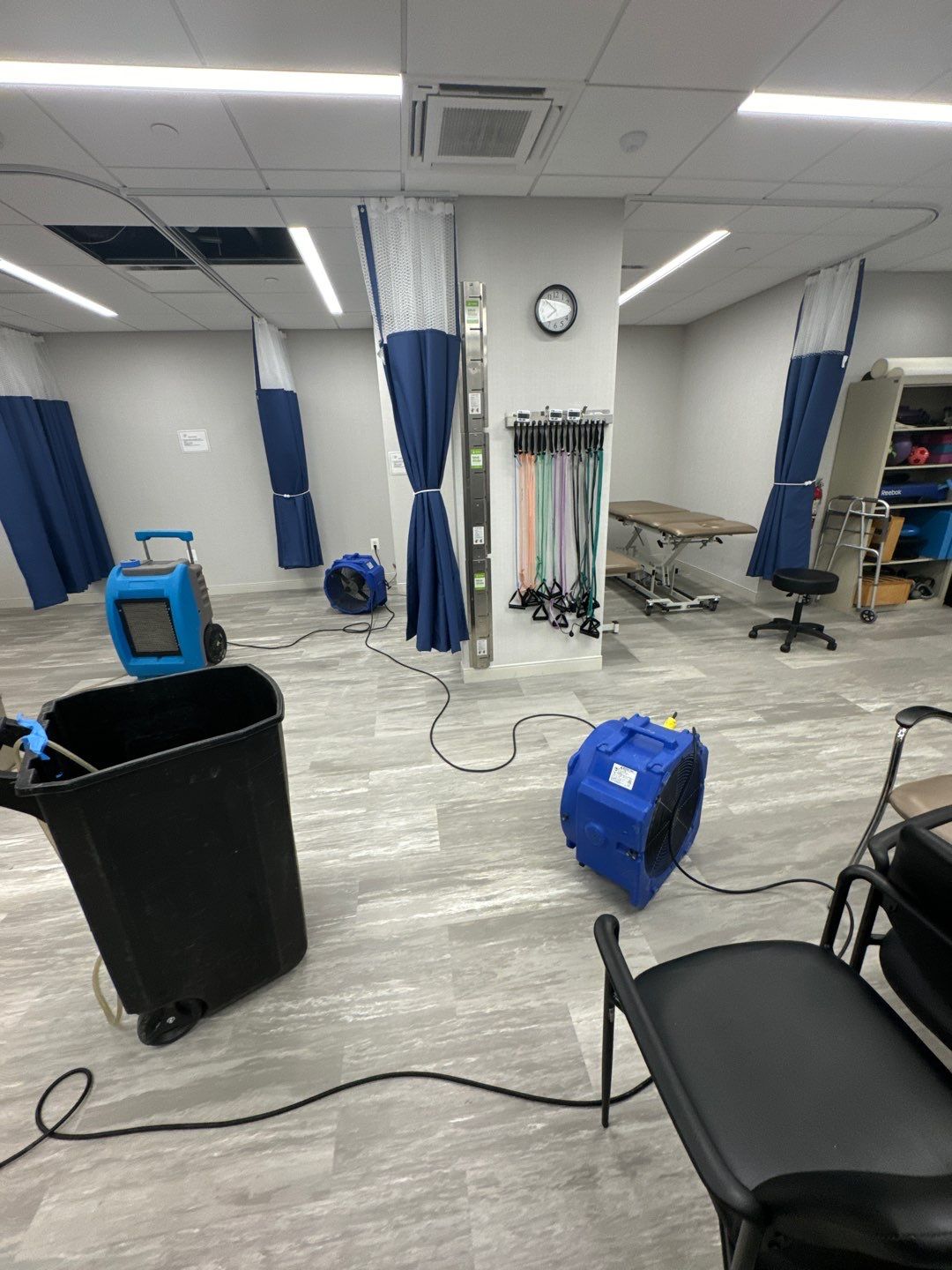 Moisture monitoring and continued drying operations during water damage restoration process.