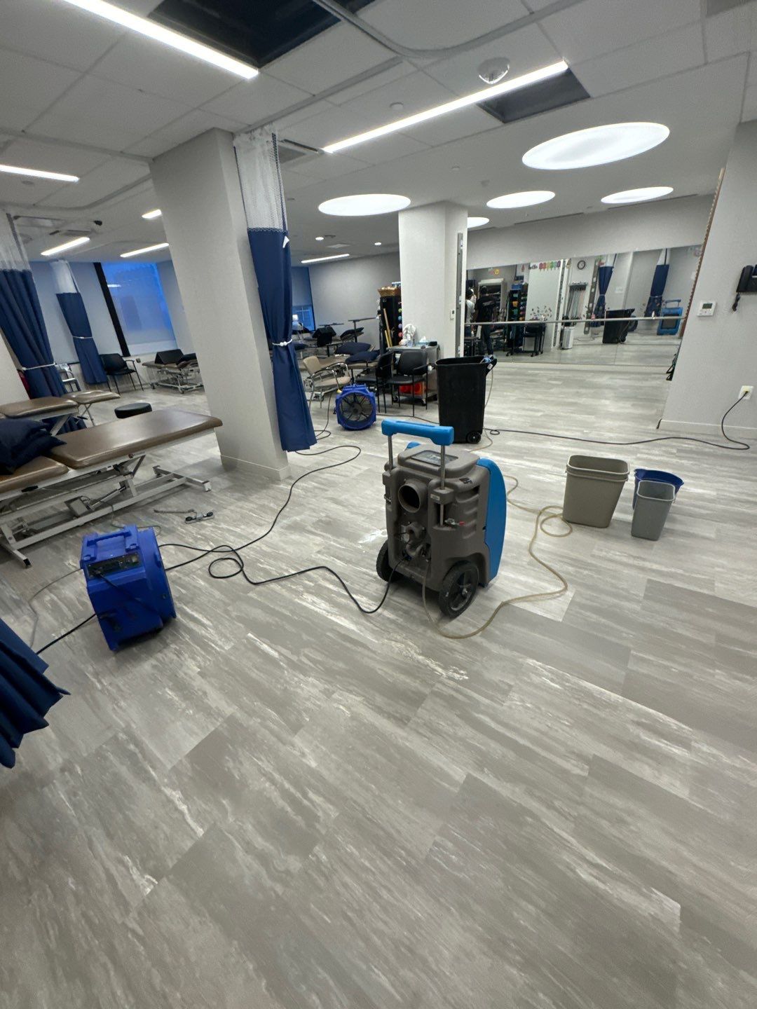 Final drying stage with equipment removal and sanitizing preparation in progress.