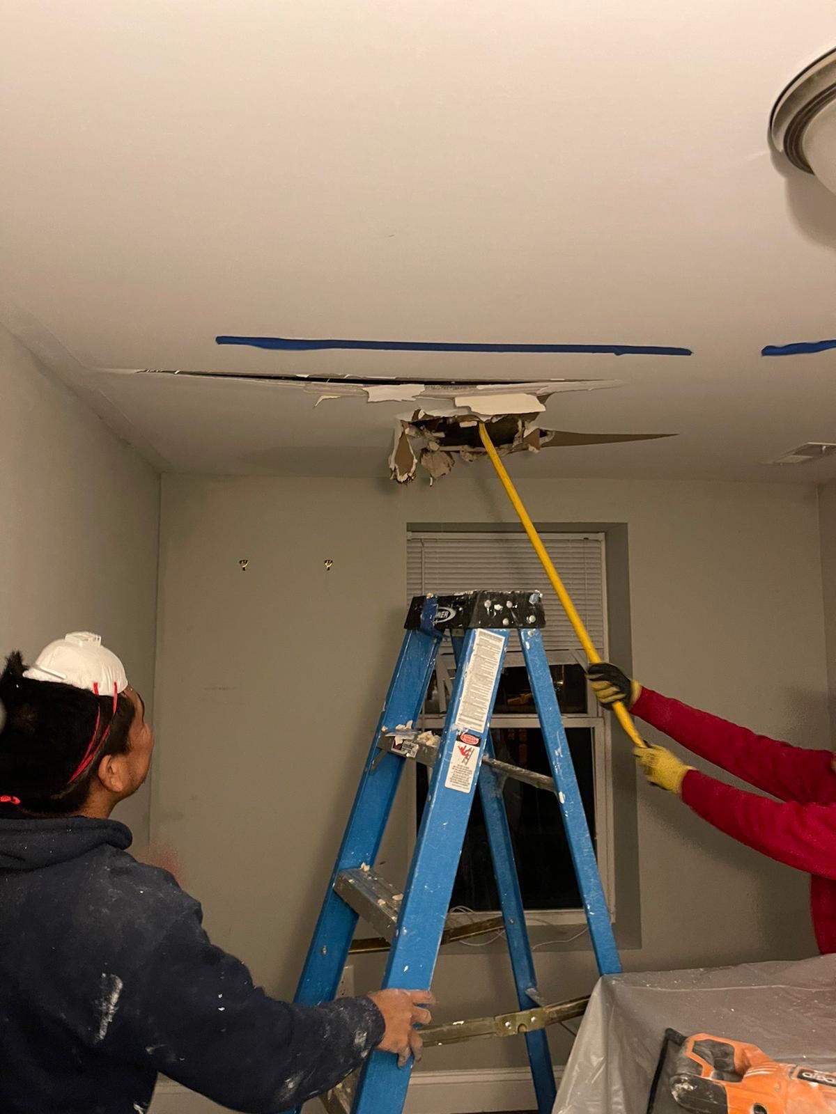 Ceiling repair completed, final stage of Washington water damage restoration showing restored drywall and finish.