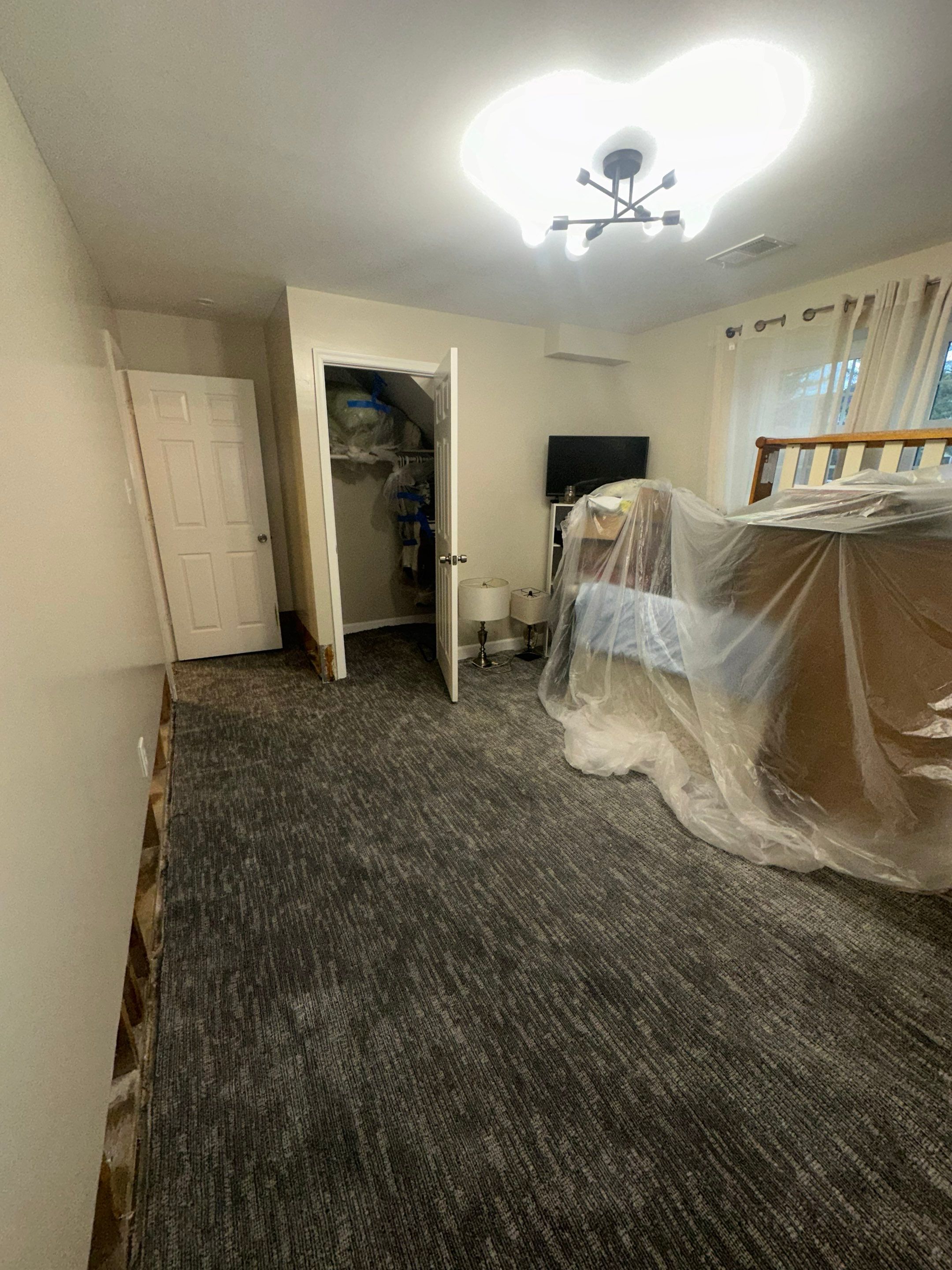Dehumidification equipment deployed mid-restoration, moisture control phase of structural drying process.