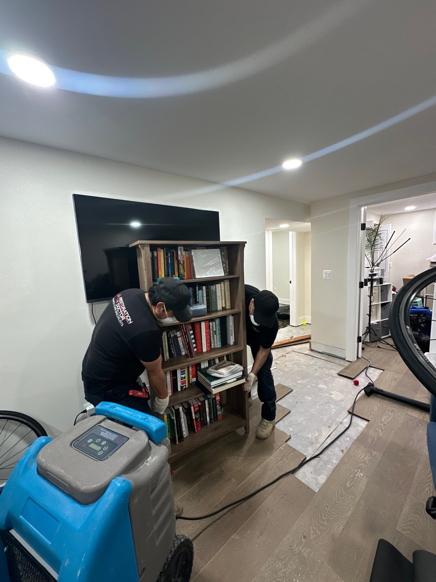 Structural drying equipment positioned within containment during mold remediation.