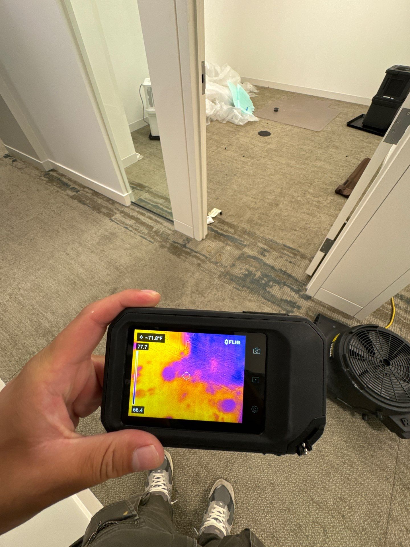 Structural drying in progress with monitoring equipment tracking moisture reduction.