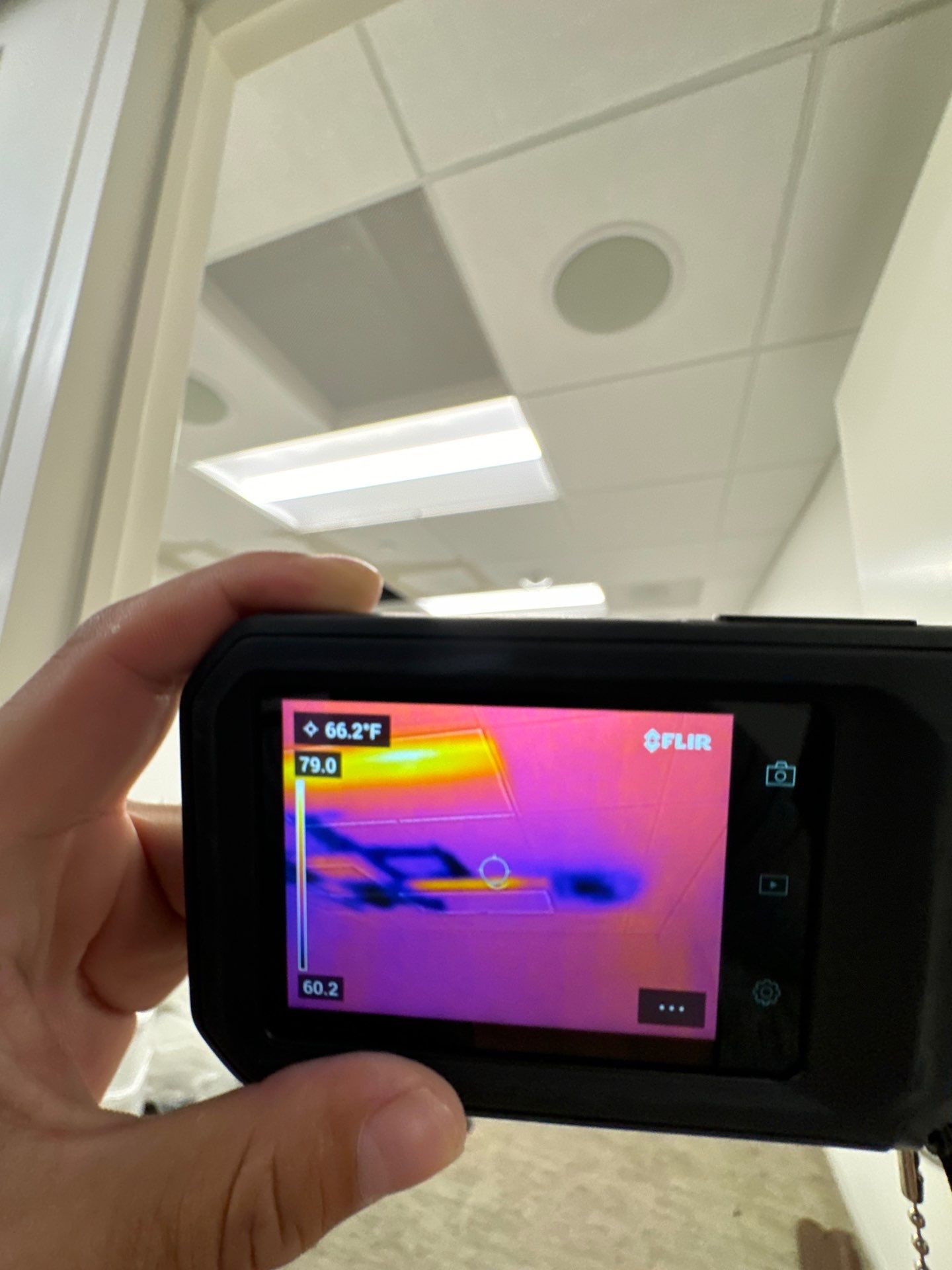 Thermal imaging camera documenting moisture patterns during mold remediation assessment in Chevy Chase.