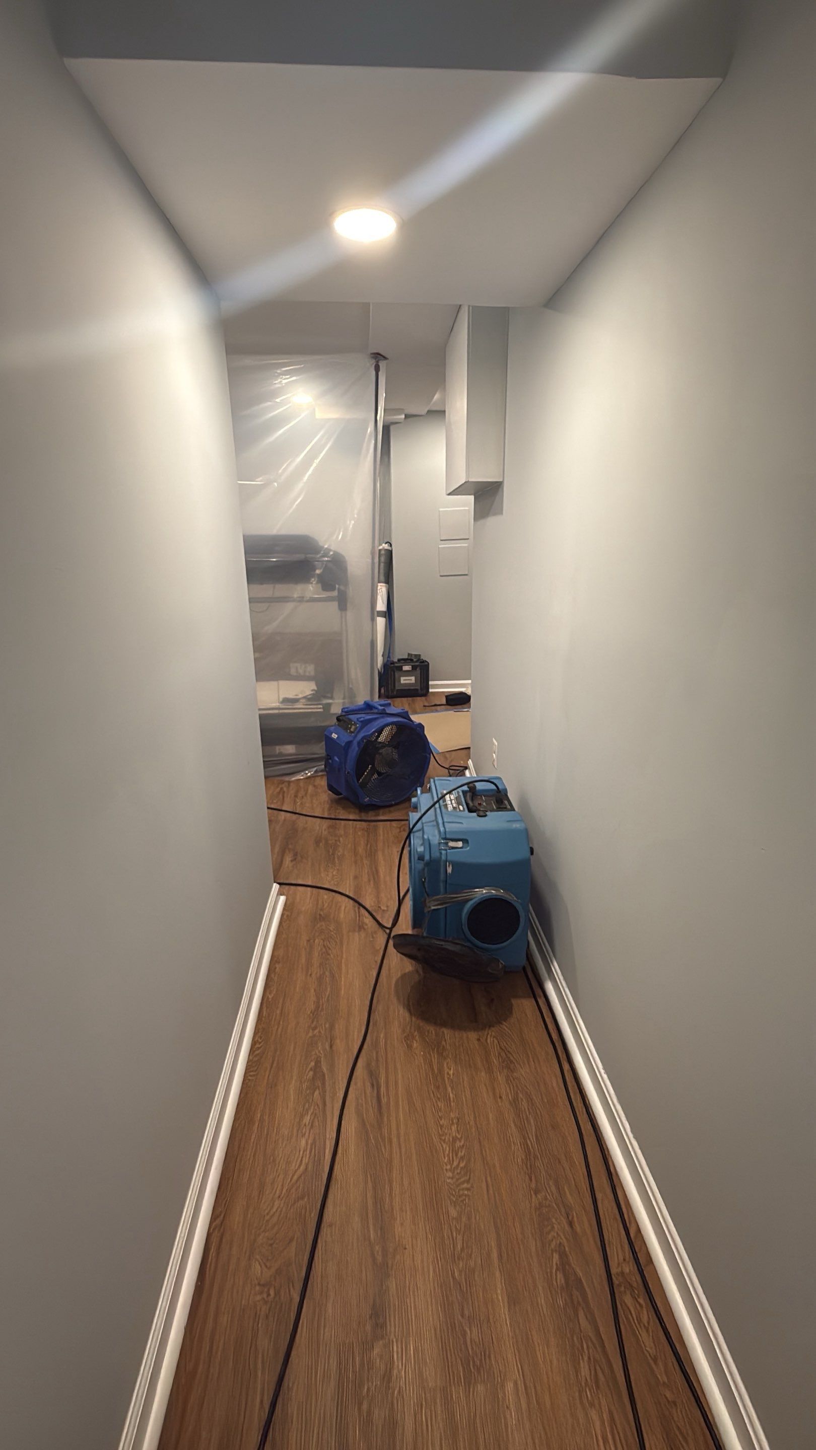 Structural drying equipment deployed to remove moisture from affected areas.