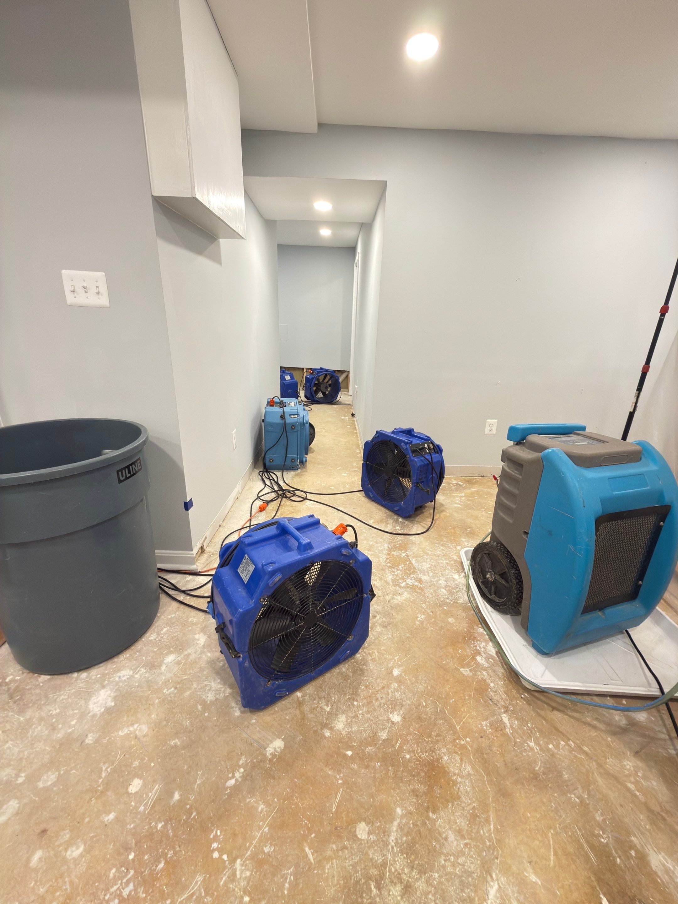 Final stages of structural drying before wall replacement begins.