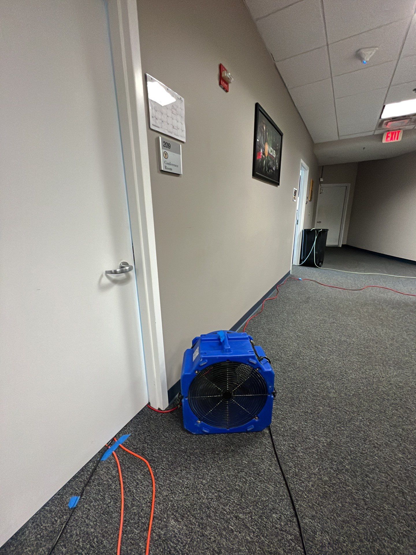 Standing water extraction underway during water damage restoration in Washington.