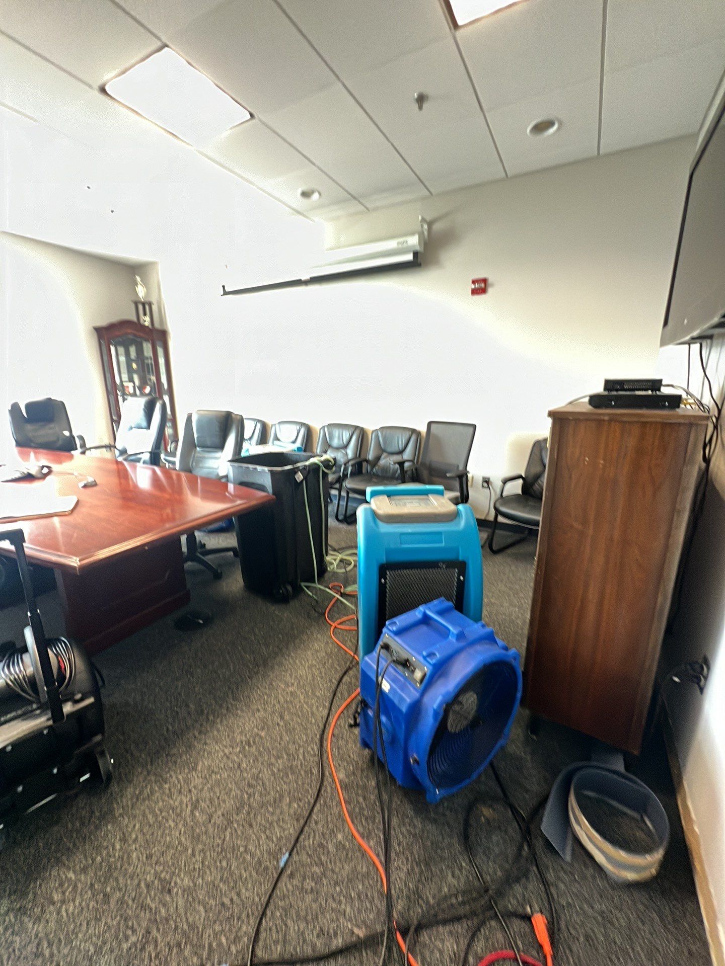 Continued dehumidification and structural drying in progress at restoration site.