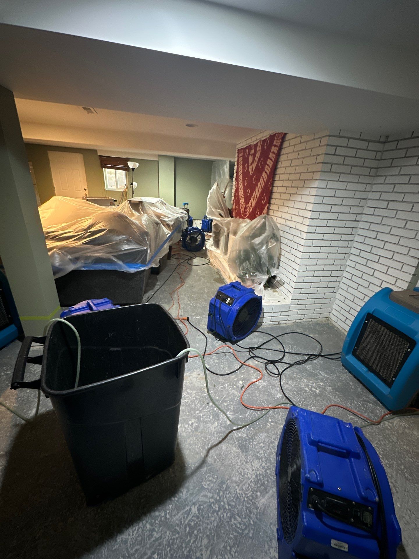 Ceiling damage assessment and preparation for repair following water extraction phase.