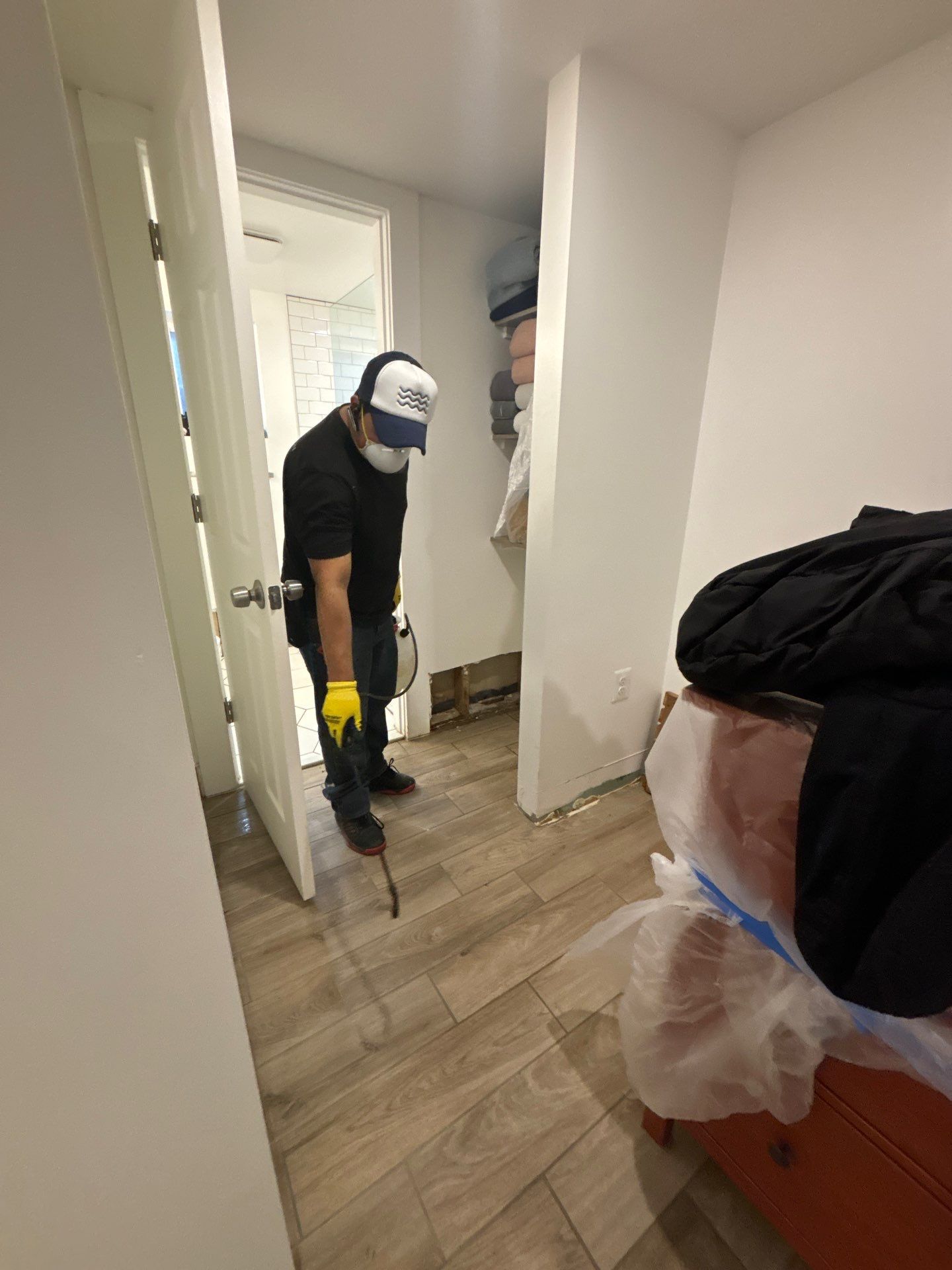 Structural drying in progress with dehumidifiers and air movers positioned throughout the space.