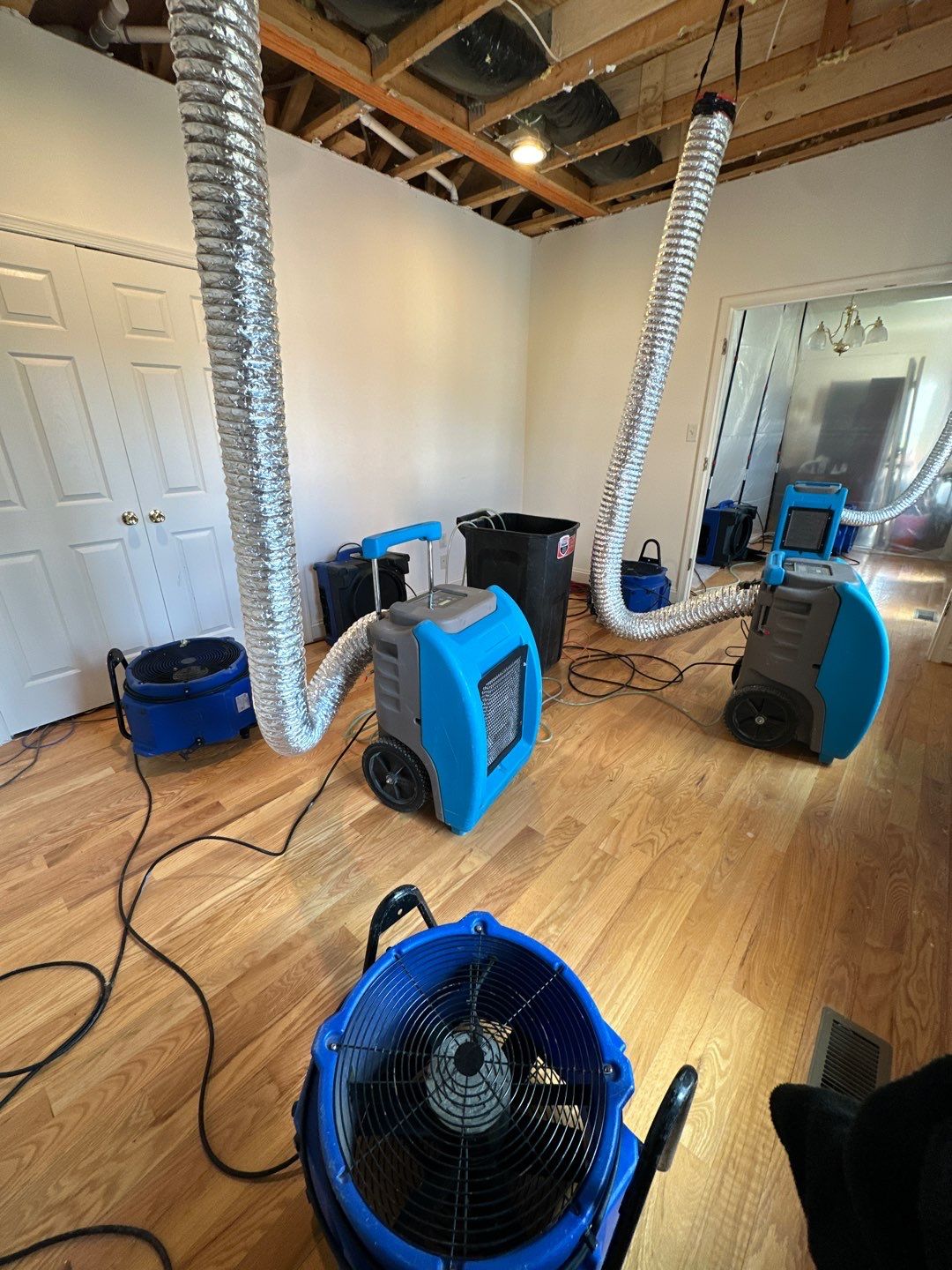 Continued dehumidification and air circulation supporting structural drying in restoration process.