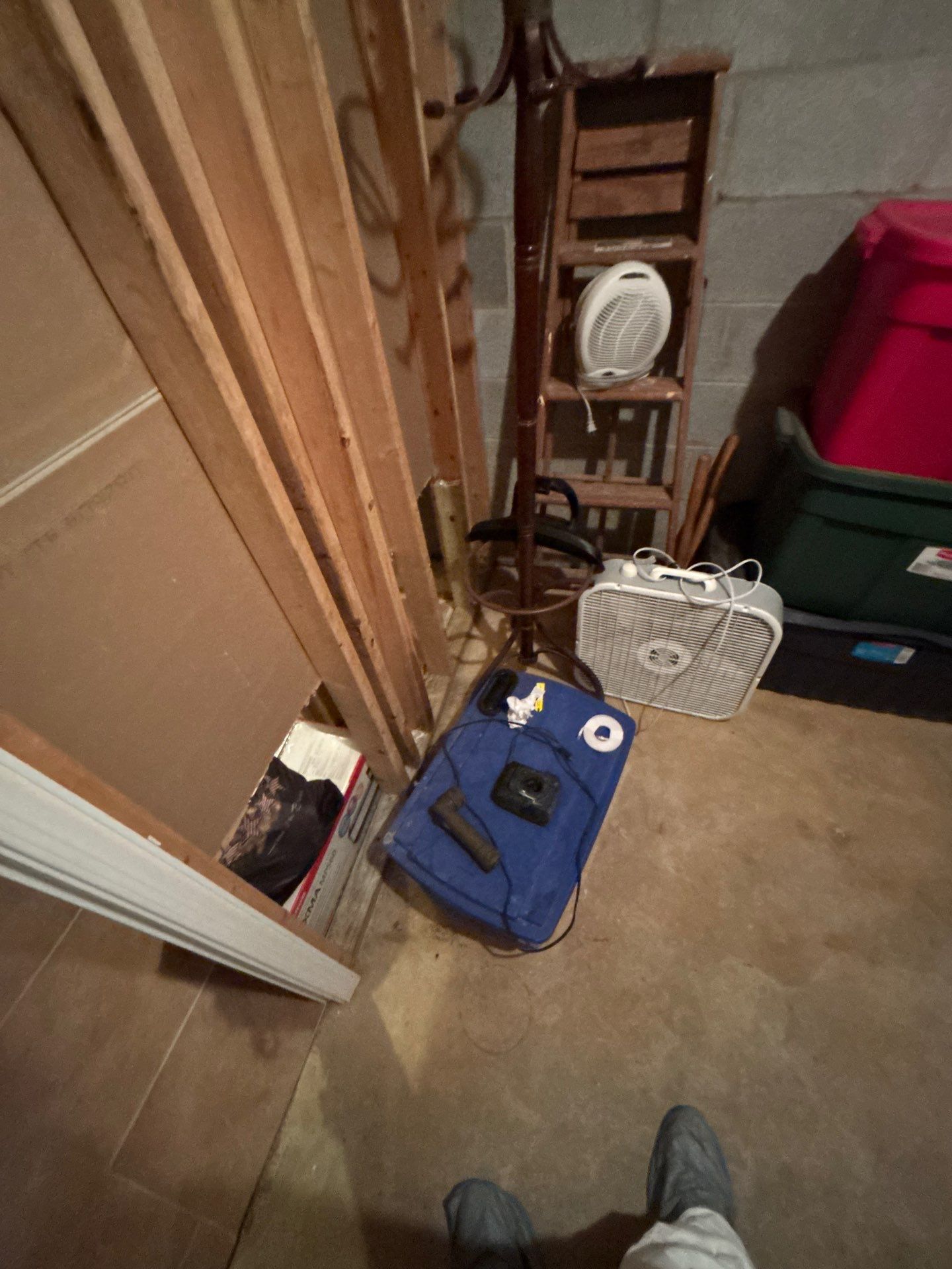 Mid-stage drying process showing dehumidifiers and air movers working to extract residual moisture from walls and subfloor.
