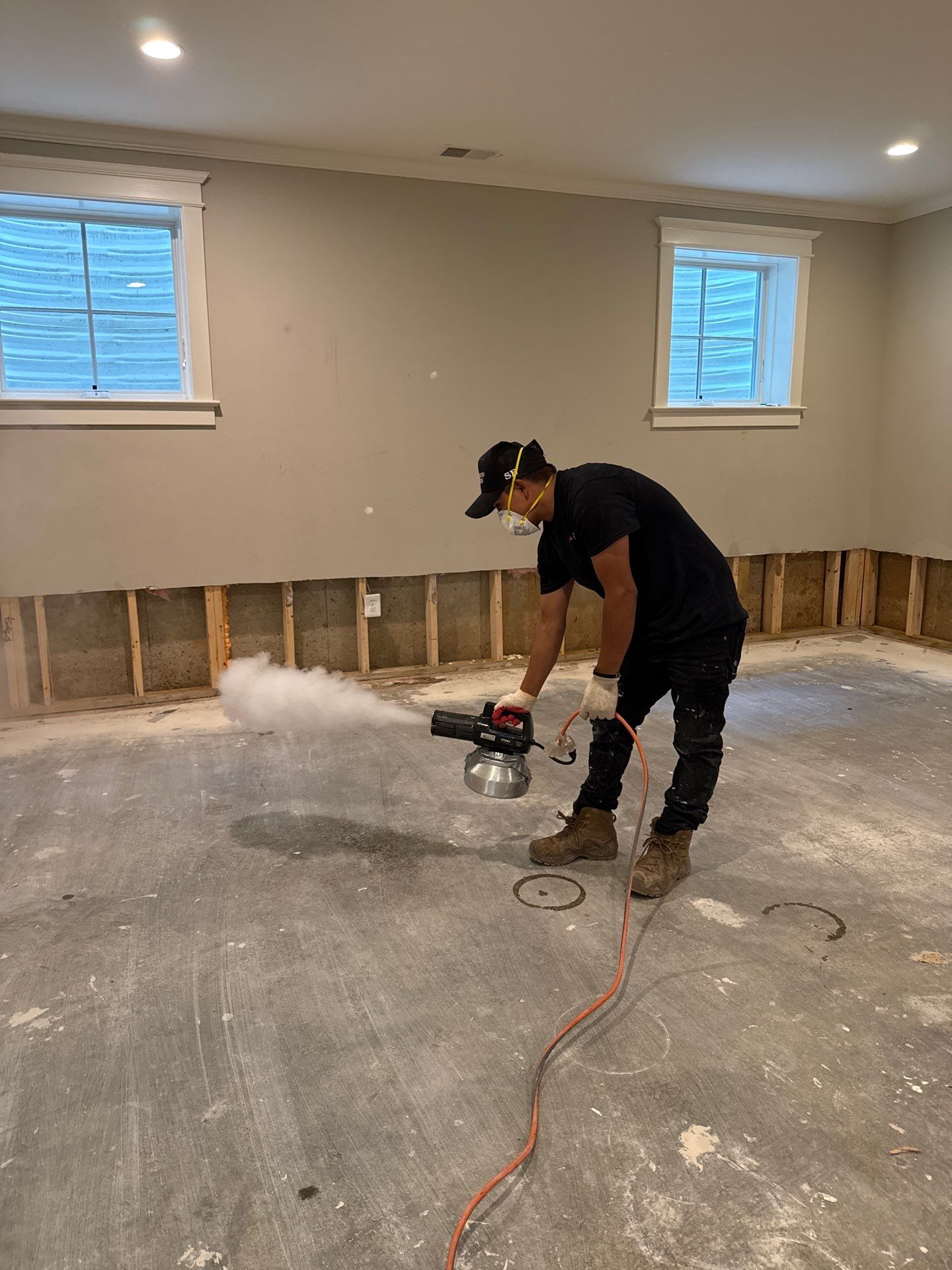 Damaged wall framing and materials staged for replacement during the remediation process.