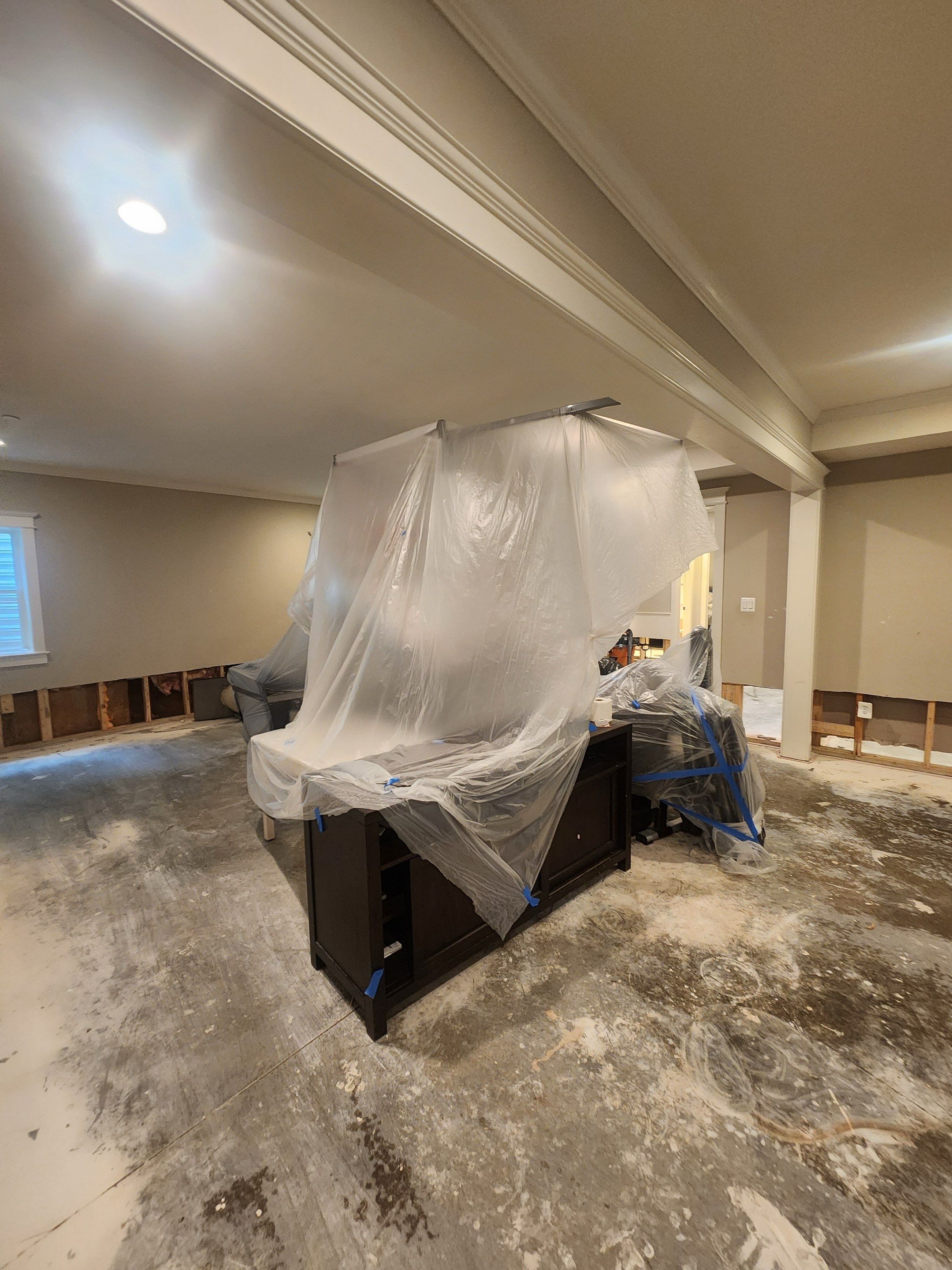 New wall assembly installed and ready for finishing following mold remediation work.