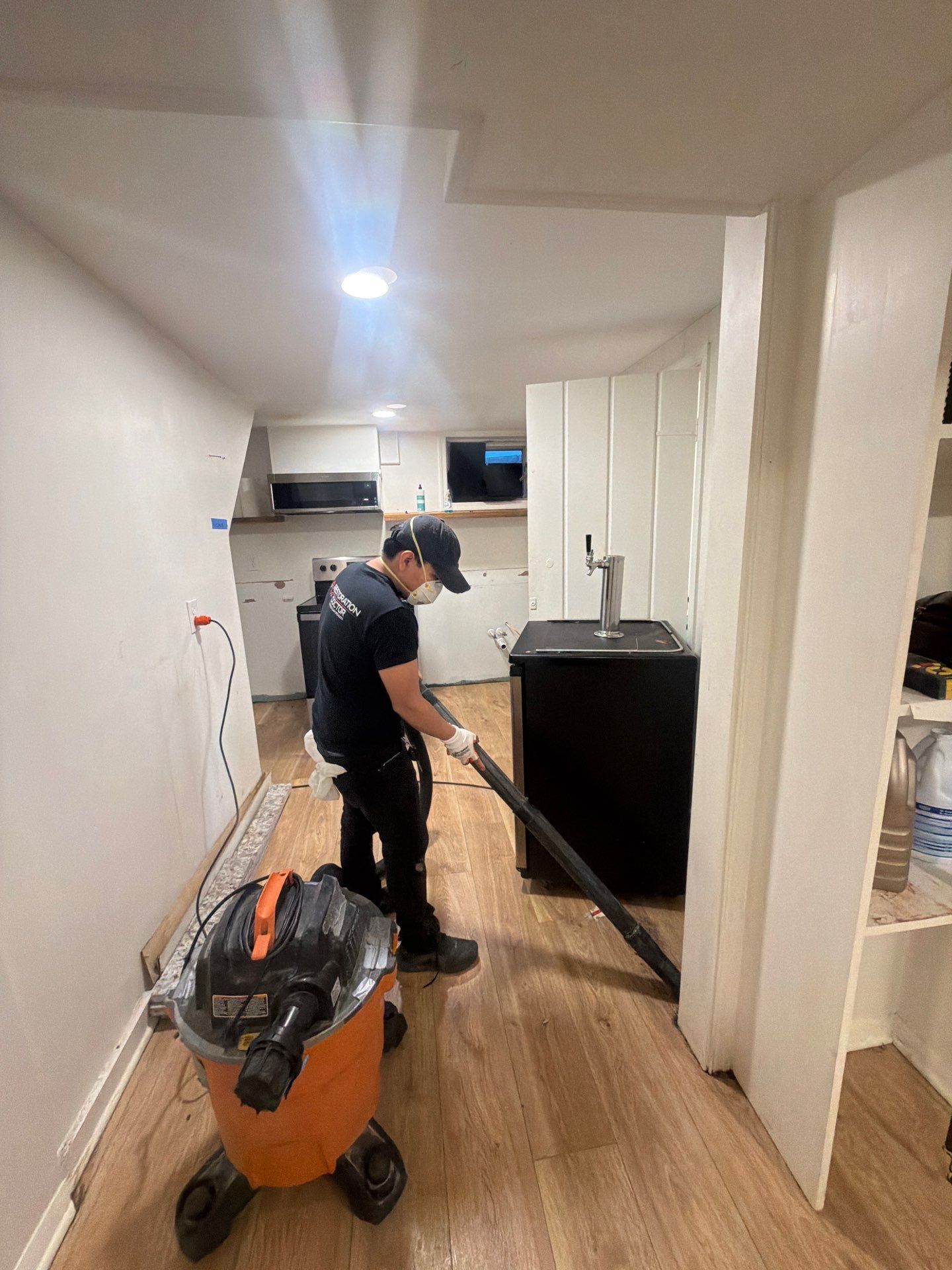 Sanitizing application to exposed subflooring and structural surfaces post-extraction.