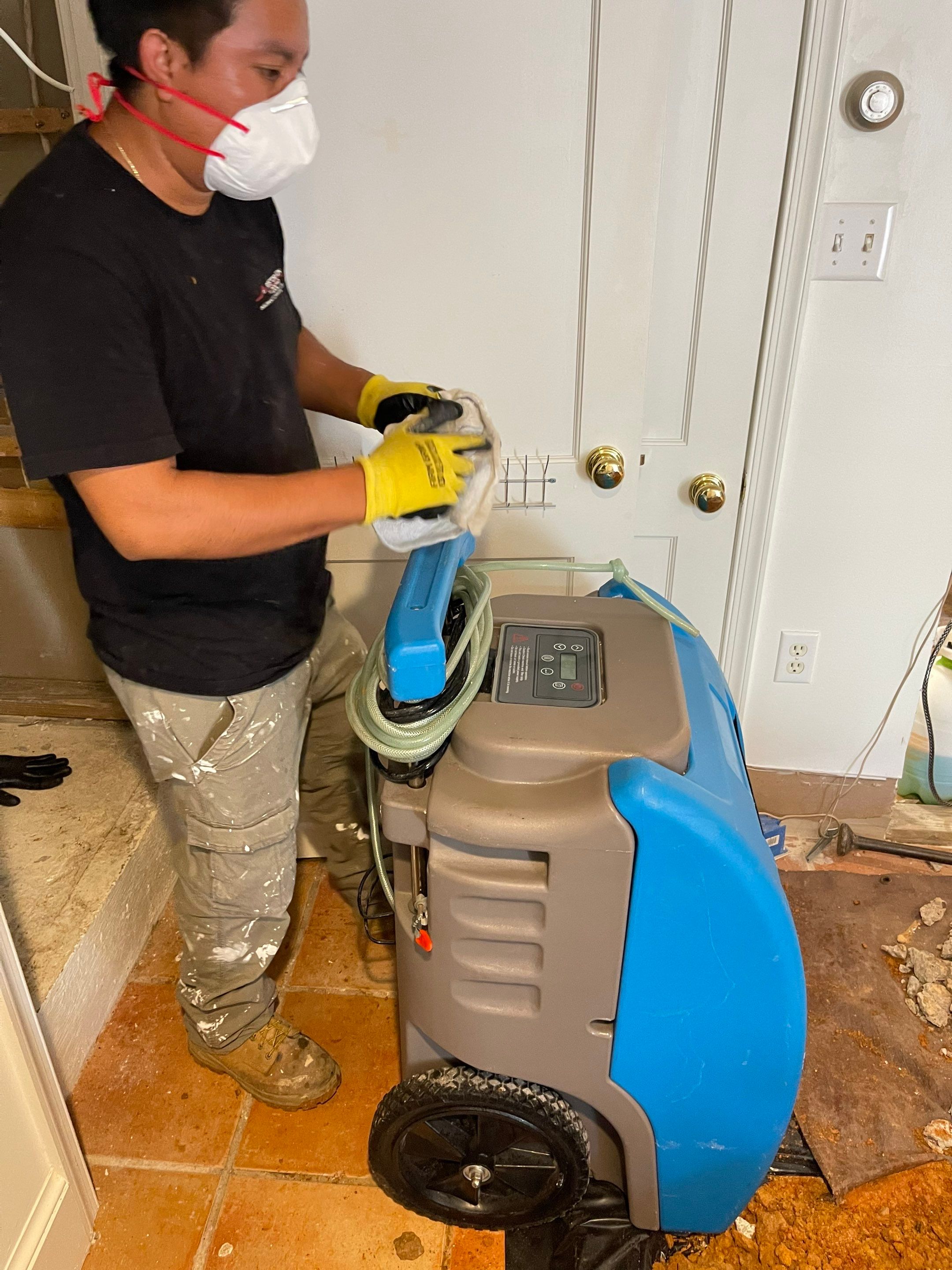 Dehumidification equipment positioned to manage moisture levels throughout the drying phase of water damage restoration.
