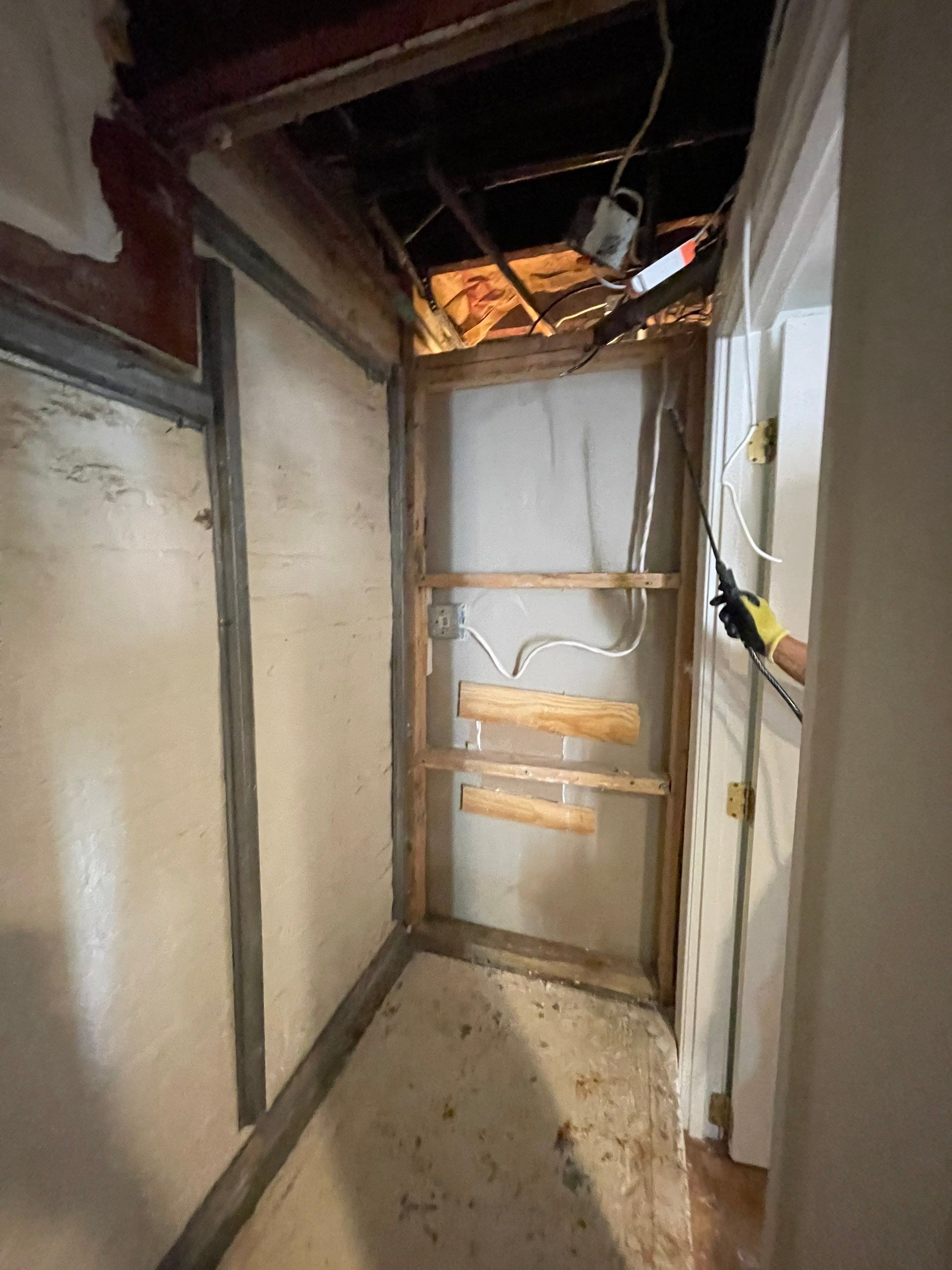 Structural drying in progress with air movers and dehumidifiers working to extract residual moisture from building materials.