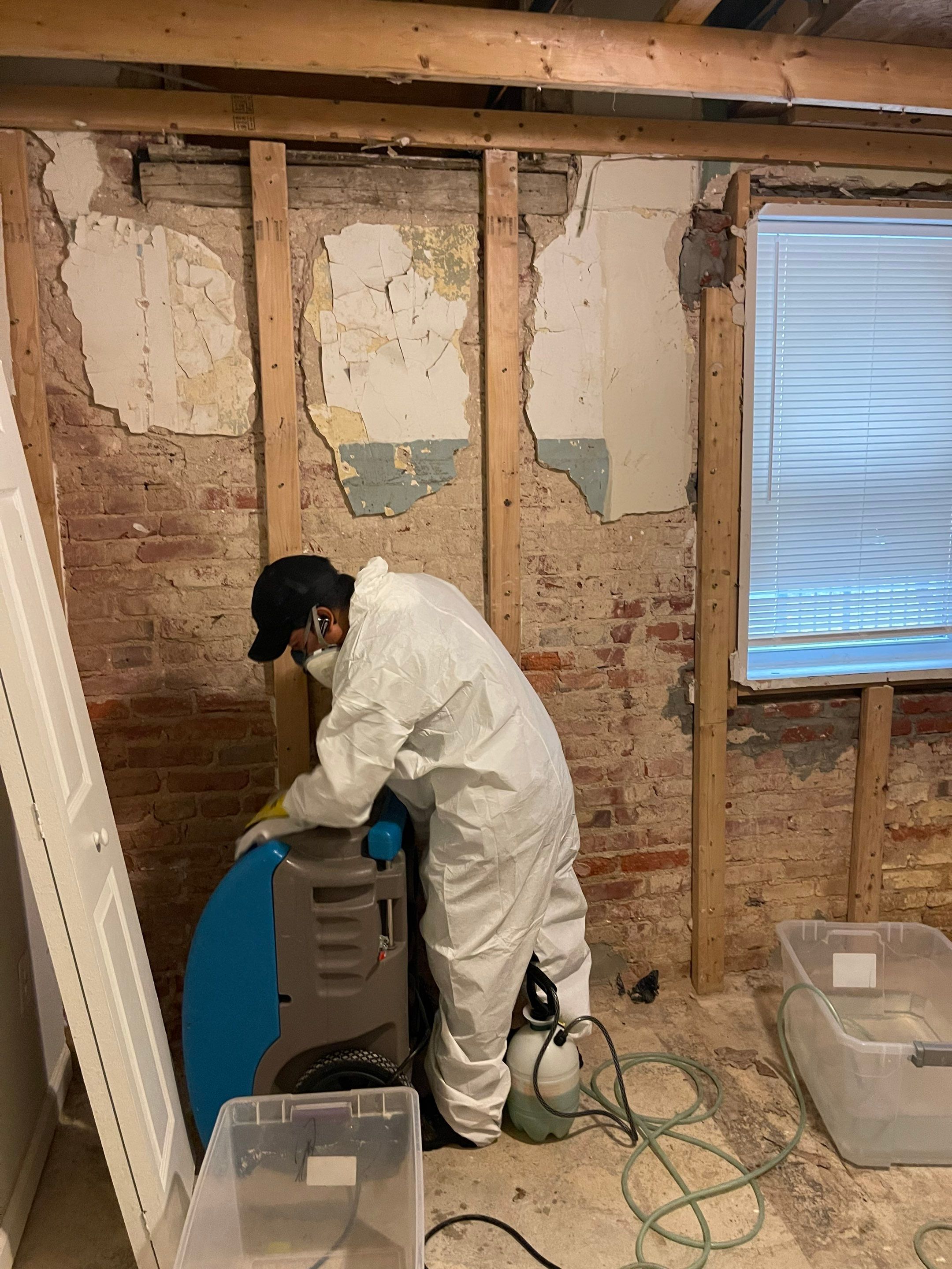 Continued monitoring and equipment adjustment as structural drying progresses, with dehumidifiers and air circulation maintained across the affected zone.