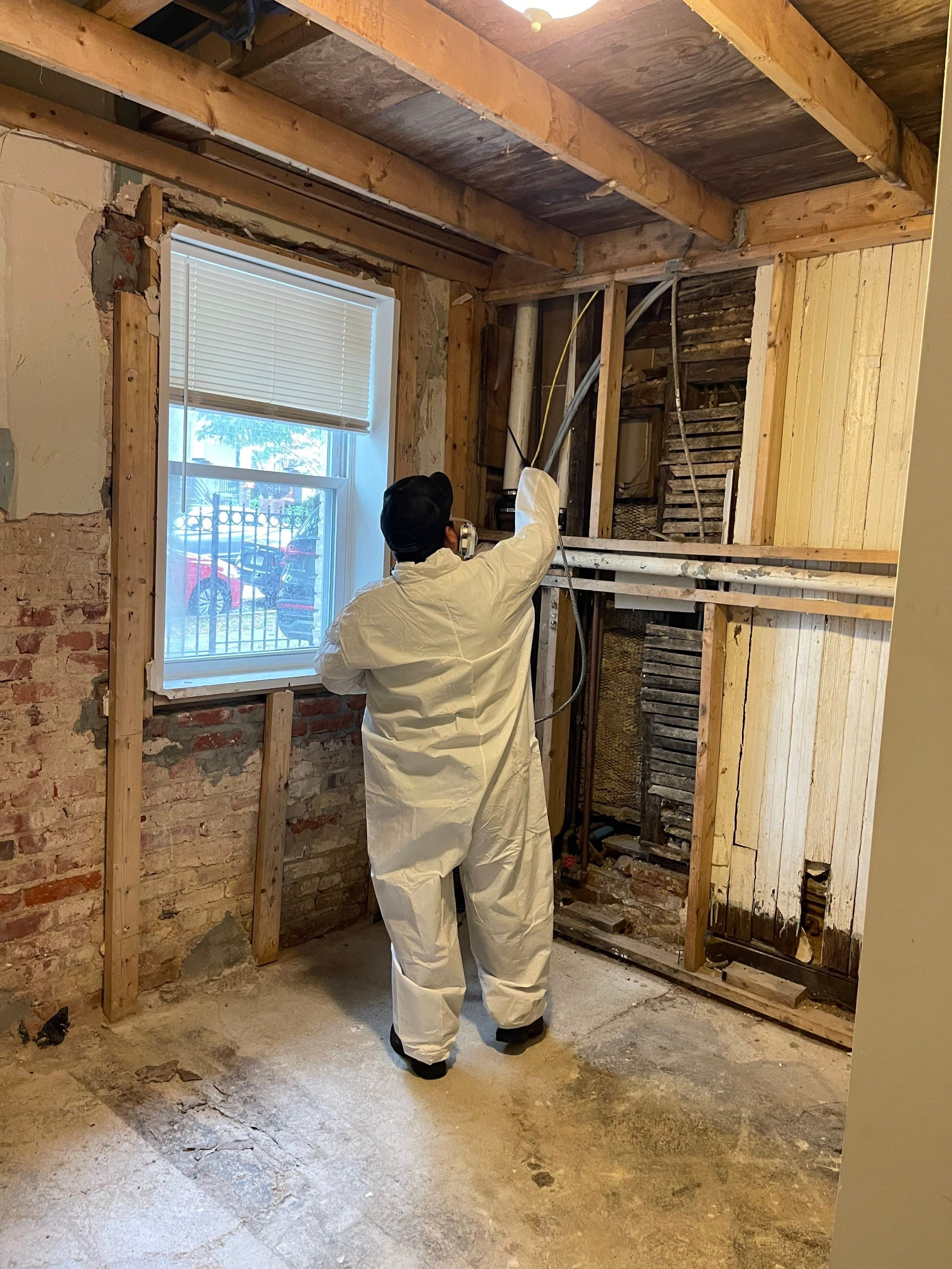 Multiple air movers and dehumidifiers operating in sequence to accelerate evaporation and moisture removal from building materials.