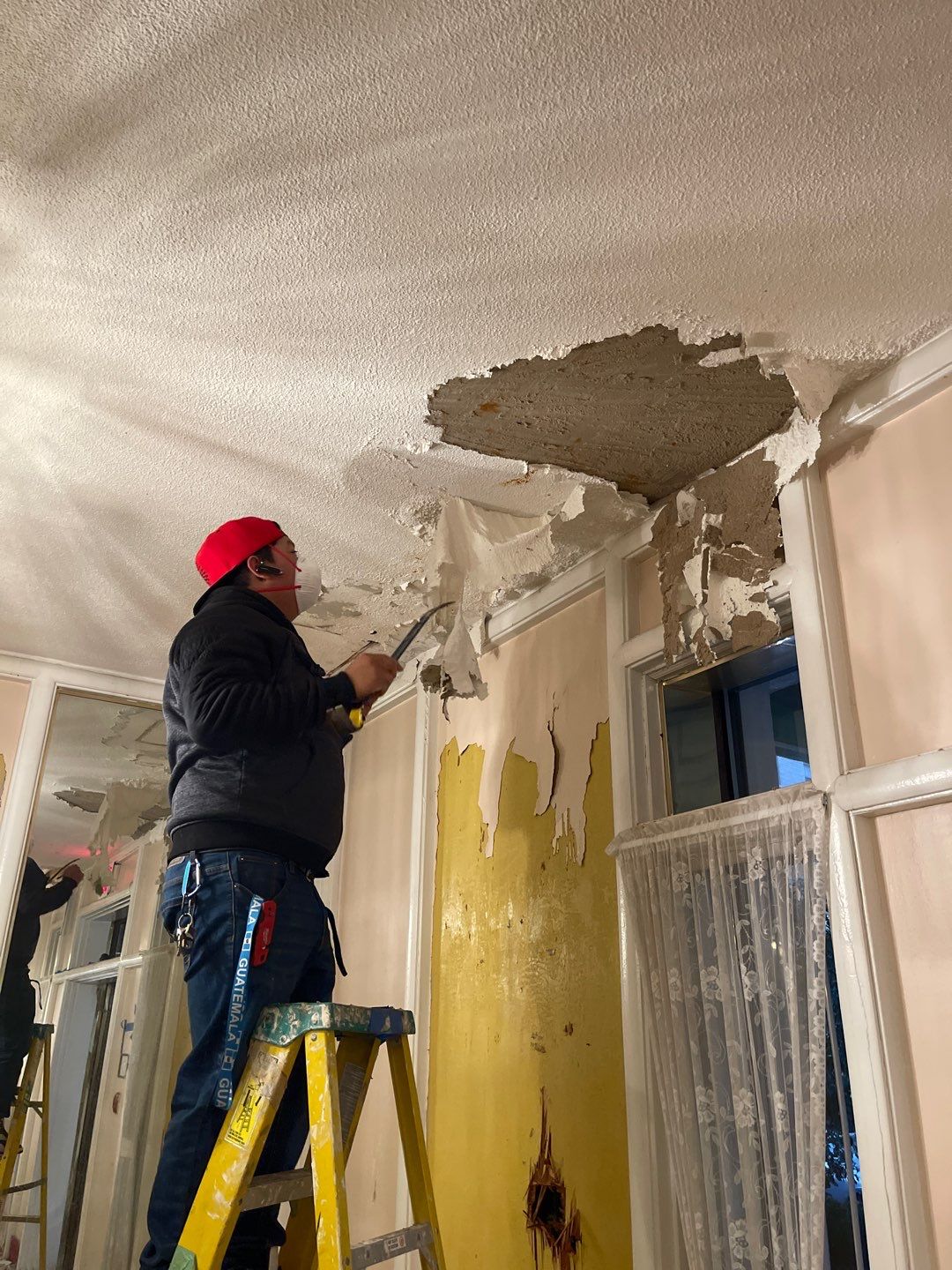 Standing water extraction underway during water damage restoration in Washington.
