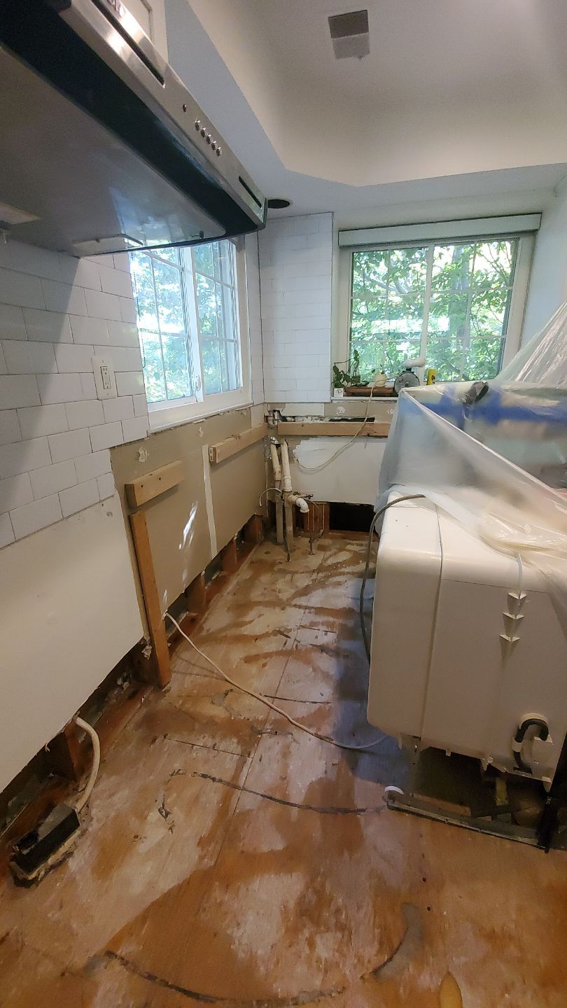 Standing water extraction underway in North Bethesda water damage restoration, initial assessment phase.
