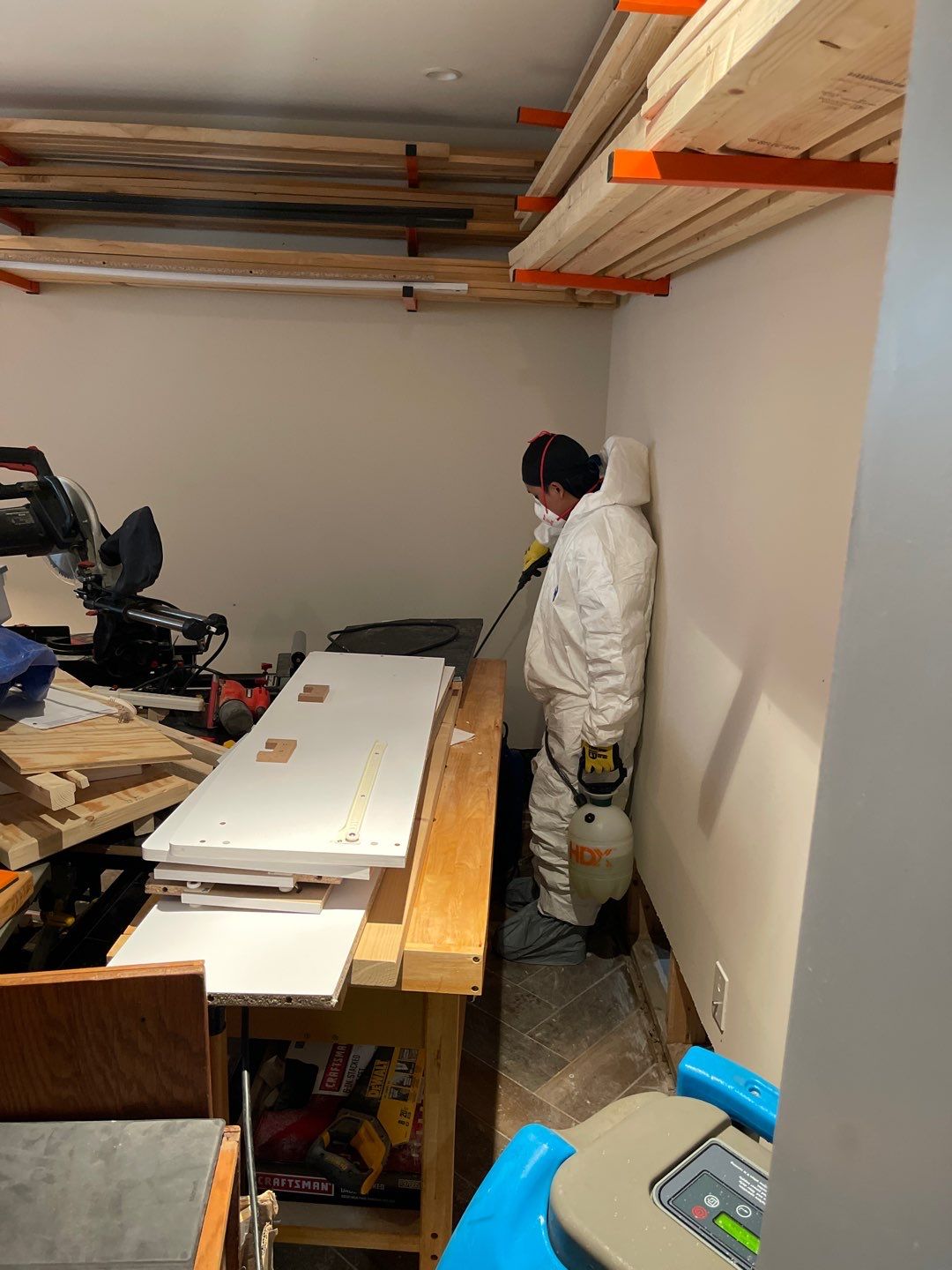 Dehumidifiers and air movers operating during structural drying phase of Washington water restoration.