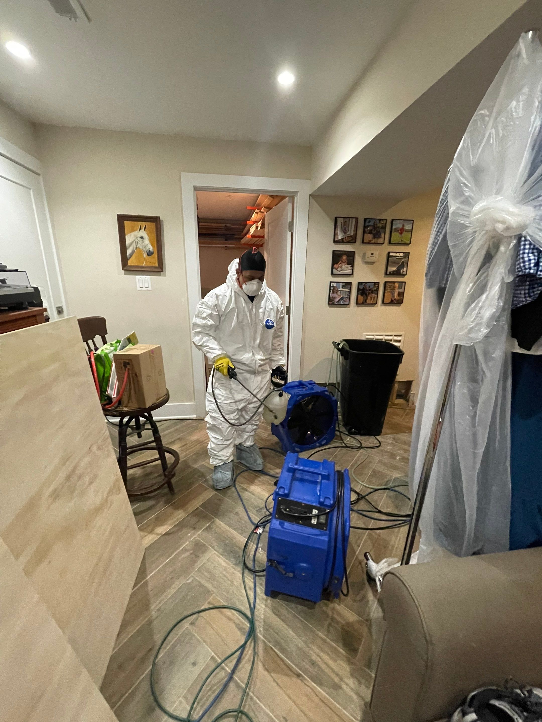 Wet carpet and flooring removal underway as part of water damage remediation in Washington.