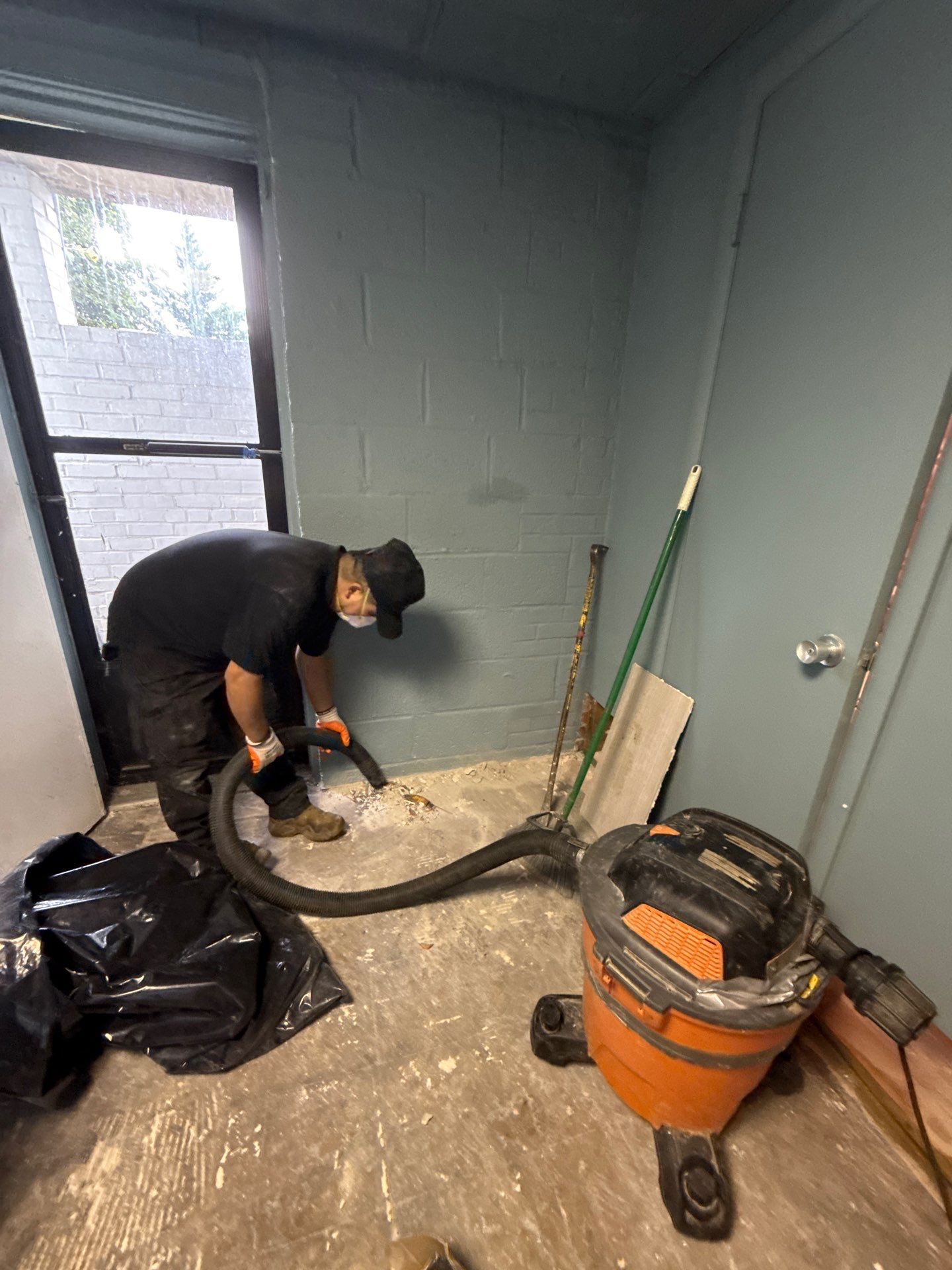 Framing and rim board exposed and drying under controlled conditions in water damage restoration.