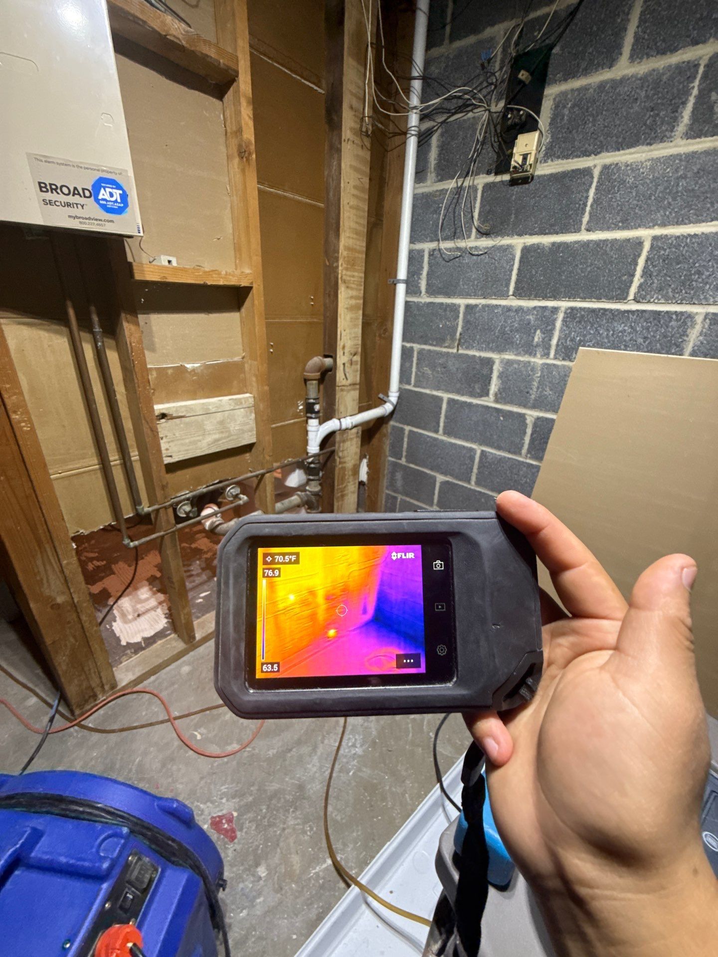 Structural drying equipment positioned to remove moisture from framing and subfloor after water extraction.