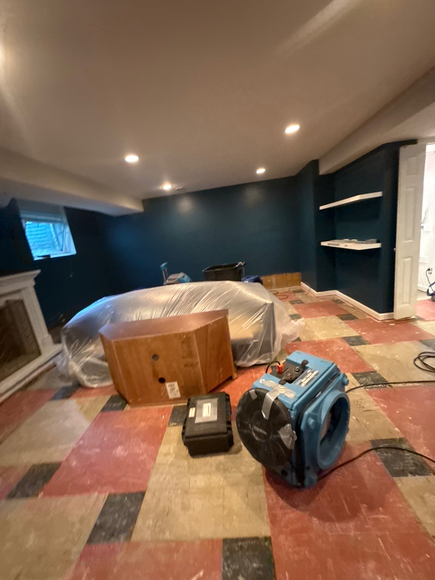 Standing water removal underway in Bethesda water damage restoration, extractors deployed across affected floor.