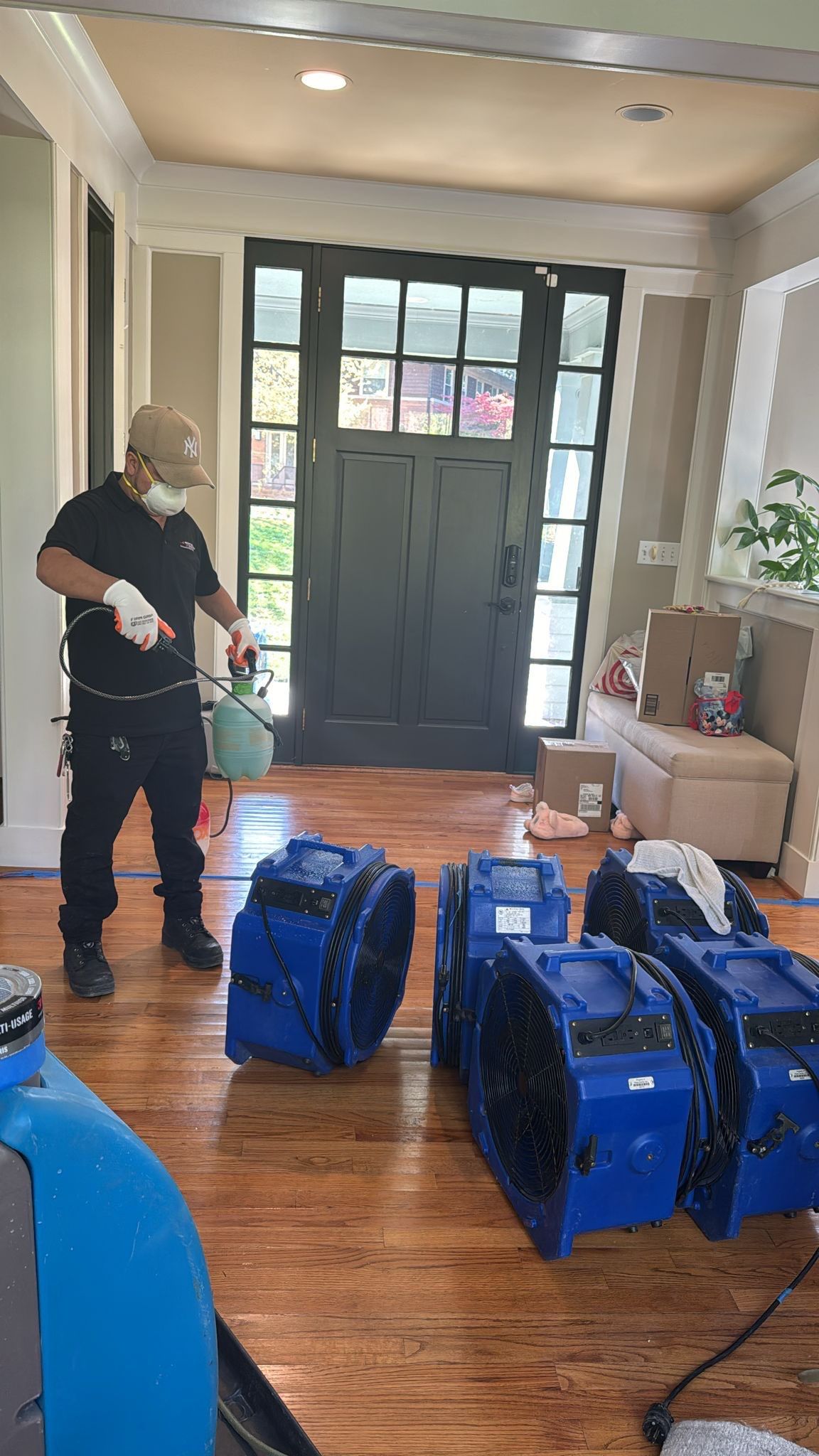 Standing water extraction underway in Potomac water damage restoration, initial assessment phase.