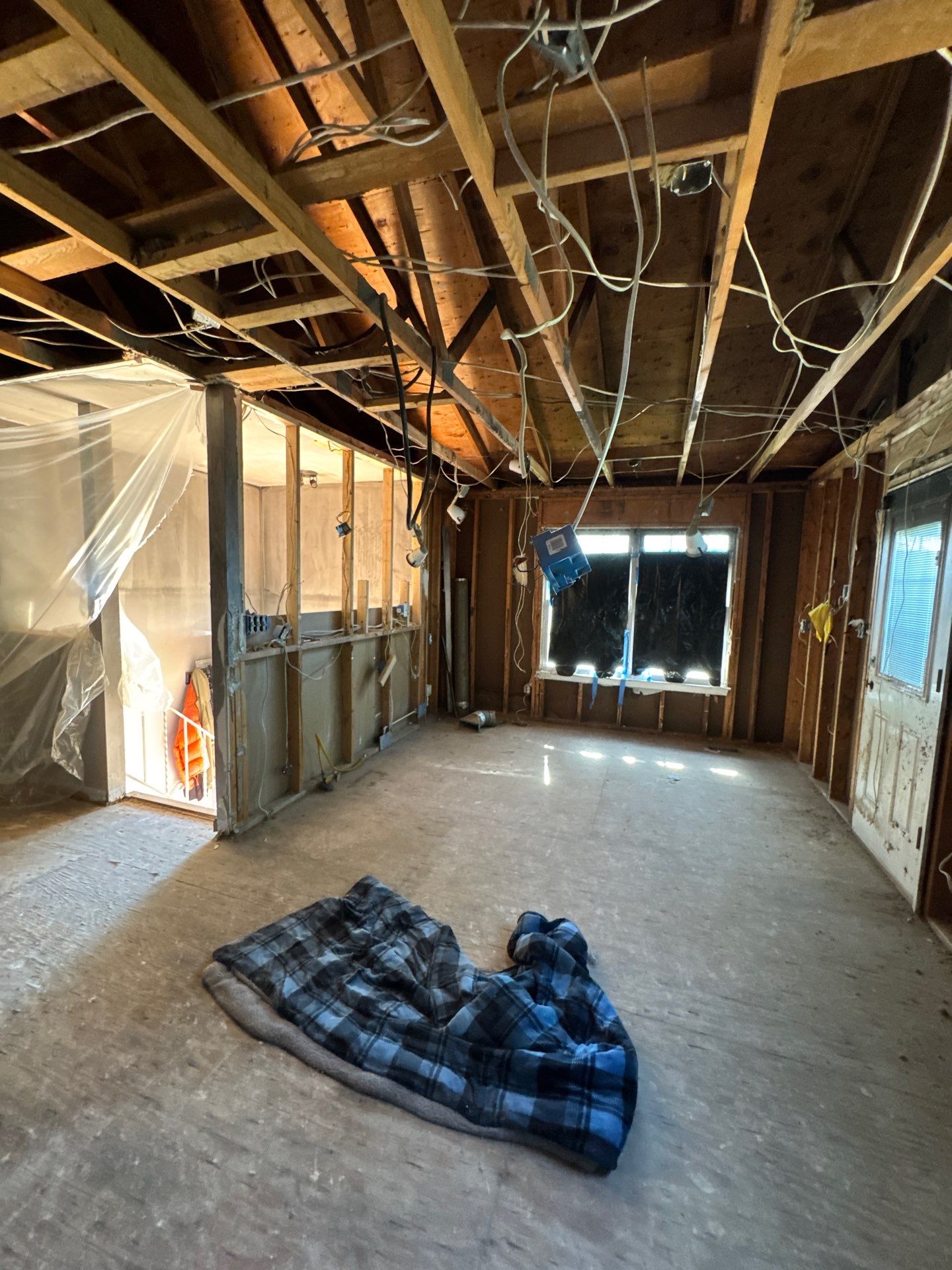 Smoke-damaged ceiling in Oxon Hill home showing soot accumulation and discoloration requiring removal.
