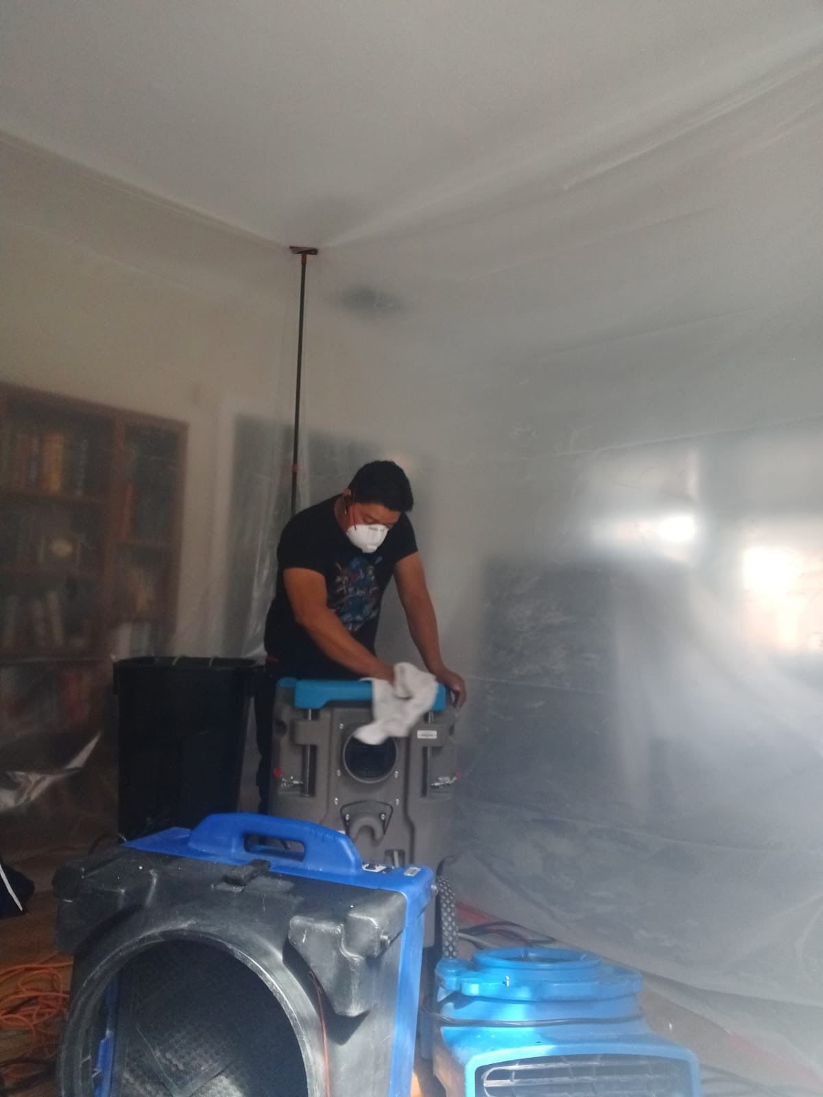 Final drying equipment in place, monitoring structural moisture levels before sanitizing phase.