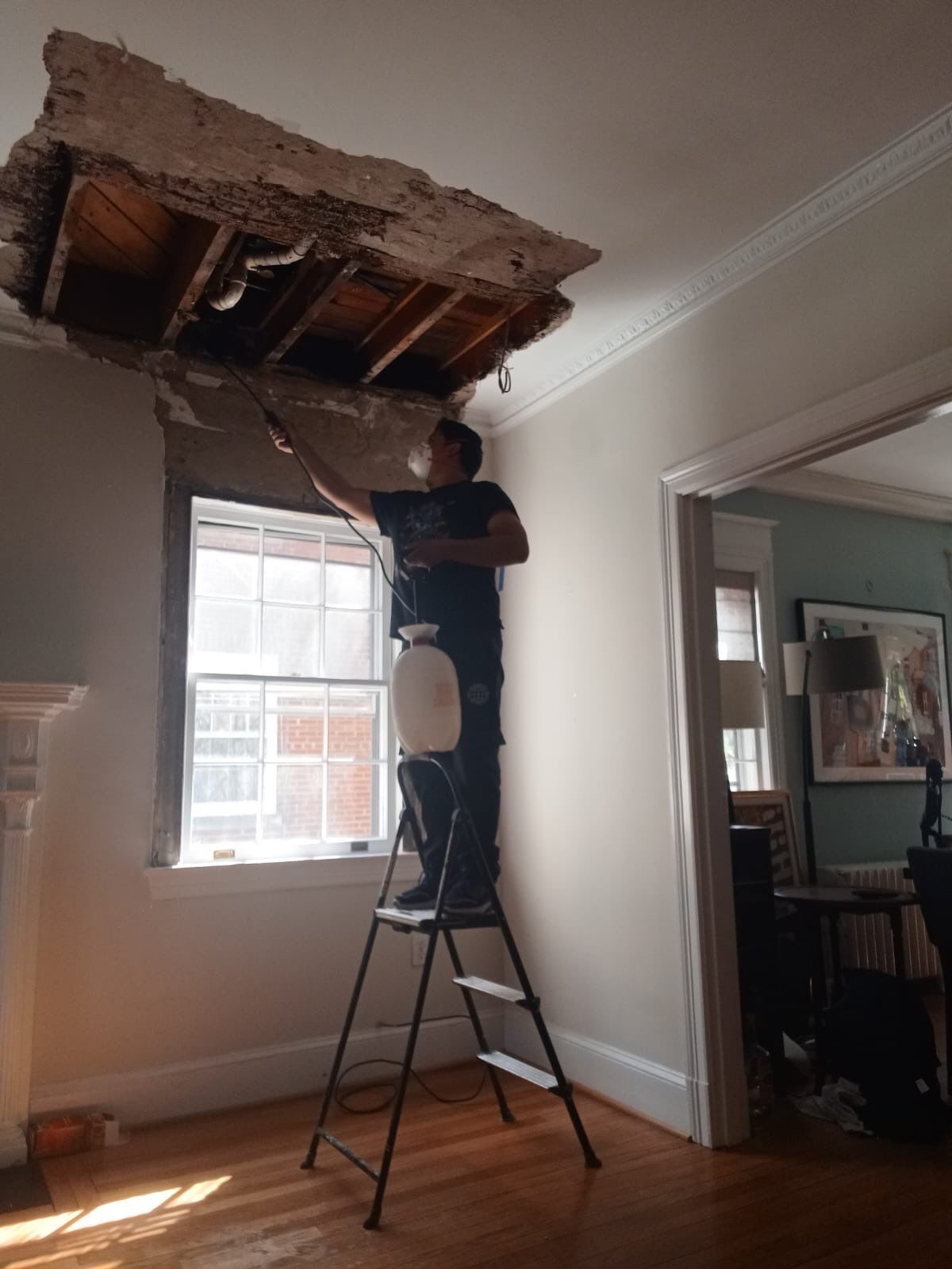 Structural drying phase with dehumidifiers and air movers deployed across affected interior spaces.