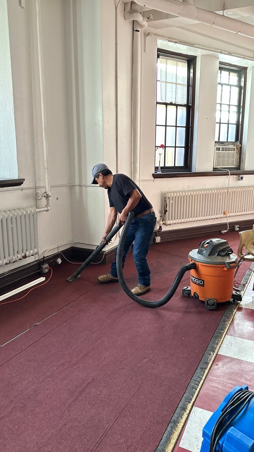 Standing water extraction underway during water damage restoration in Washington.